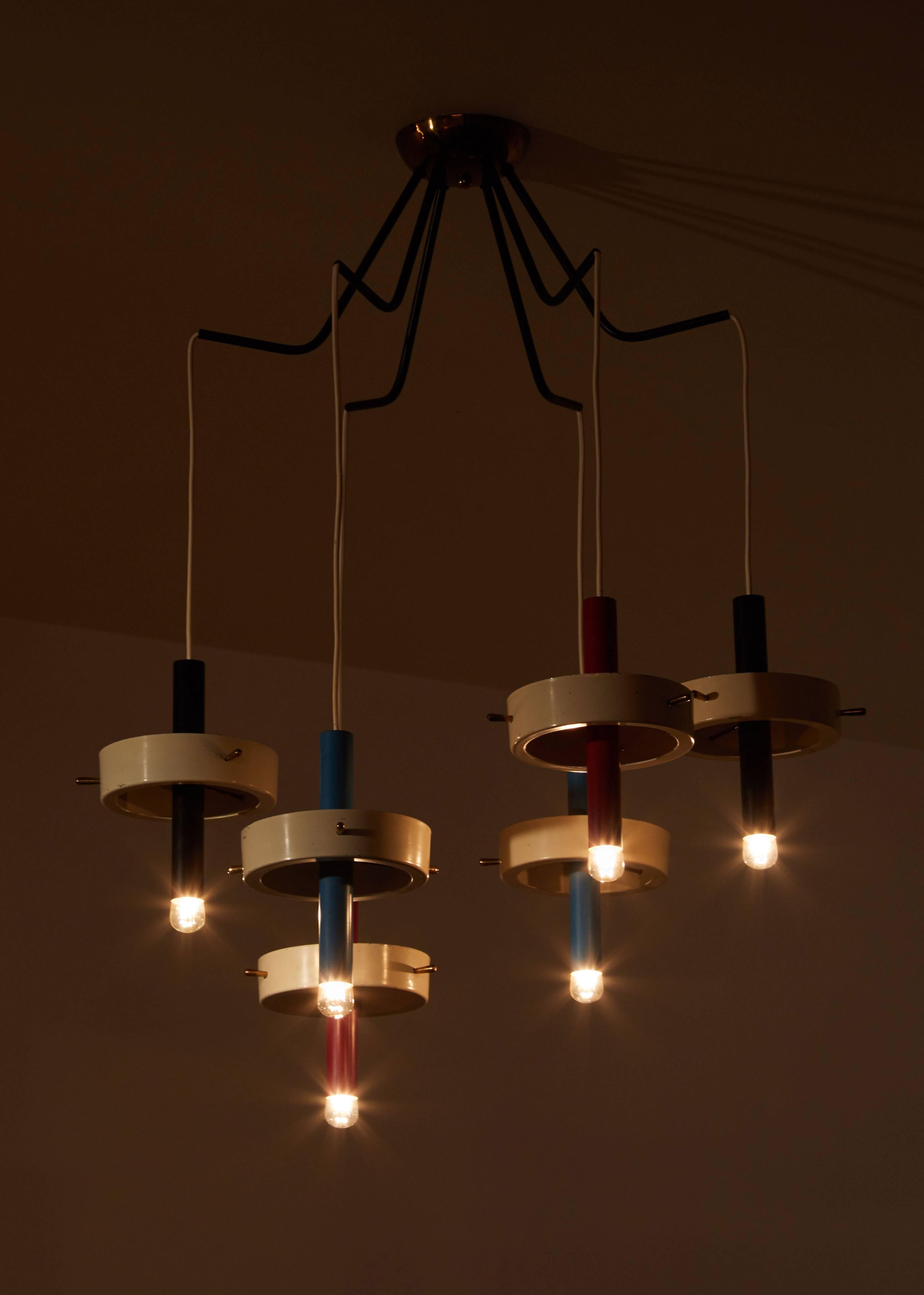 Six-arm chandelier designed in Italy, circa 1960s. Painted iron tubes, lacquered aluminium and brass. Wired for US junction boxes. Original canopy. Each tube takes one E14 25w maximum European candelabra bulb. Overall drop can be adjusted.
 