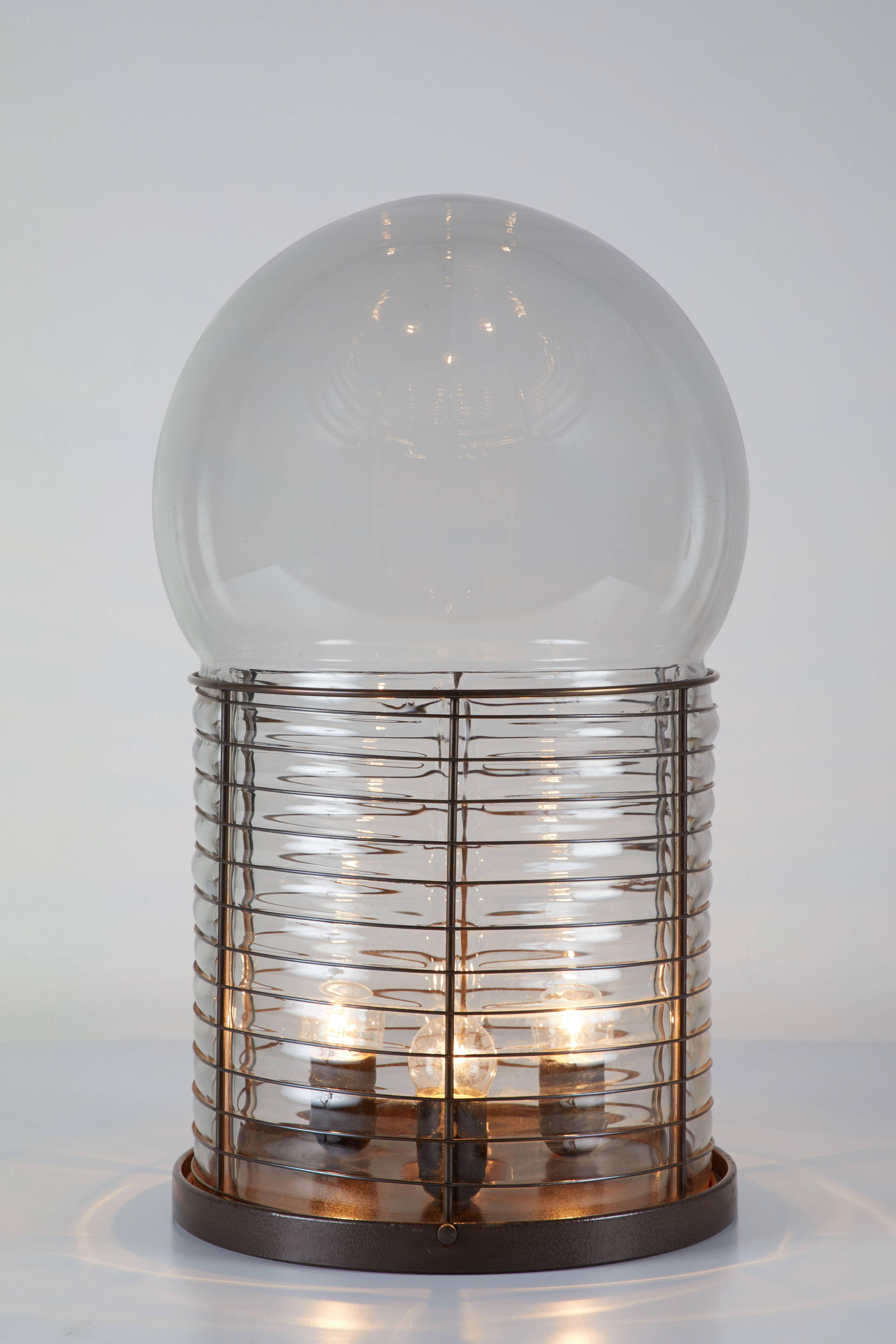 Original vintage table lamp designed by Gae Aulenti for Artemide in Italy, circa 1970. Glass diffuser with iron structure. Original cord. Takes three E27 100w maximum bulbs.
