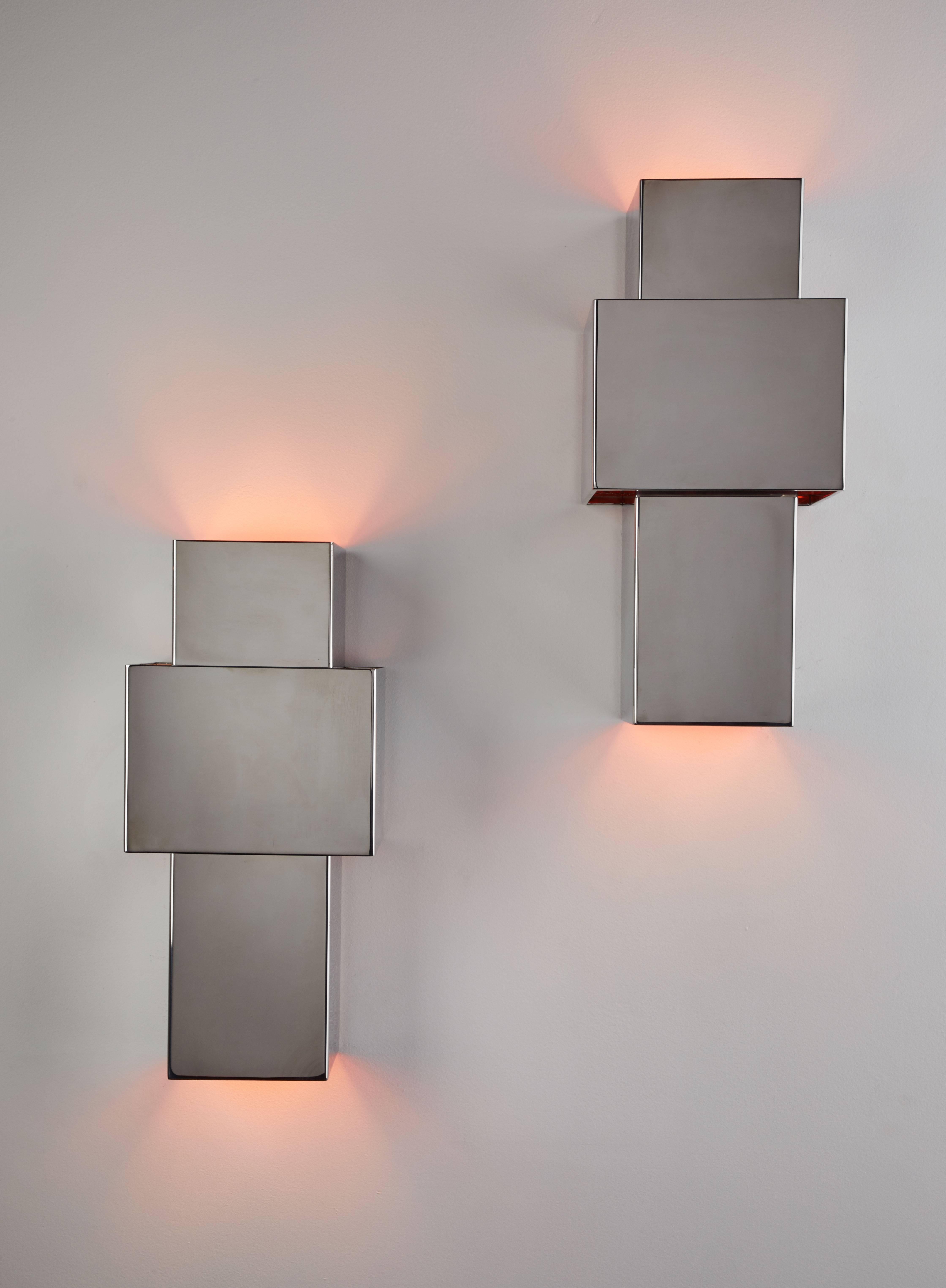 Pair of Love sconces designed by Willy Rizzo in Italy, circa 1970s. Chrome-plated stainless steel with copper exterior. Wired for US junction boxes. Each sconce takes one E14 100w maximum bulb.