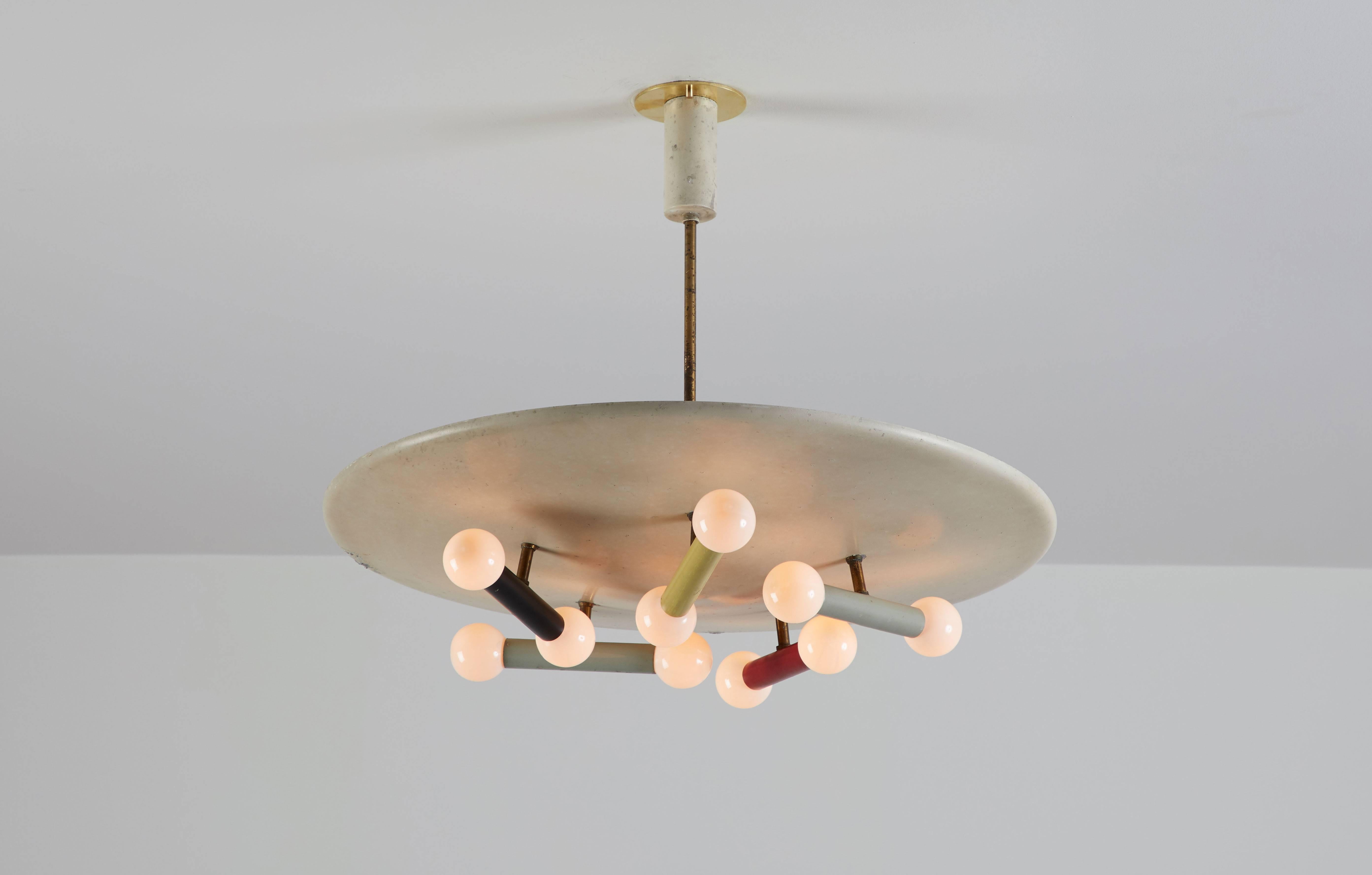 Italian pendant by Oscar Torlasco for Lumi. Manufactured in Italy, circa 1950s. Painted aluminum, brass hardware. Wired for US junction boxes. Custom brass canopy. Takes ten E14 25w maximum bulbs, three e27 60w maximum bulbs.
    
