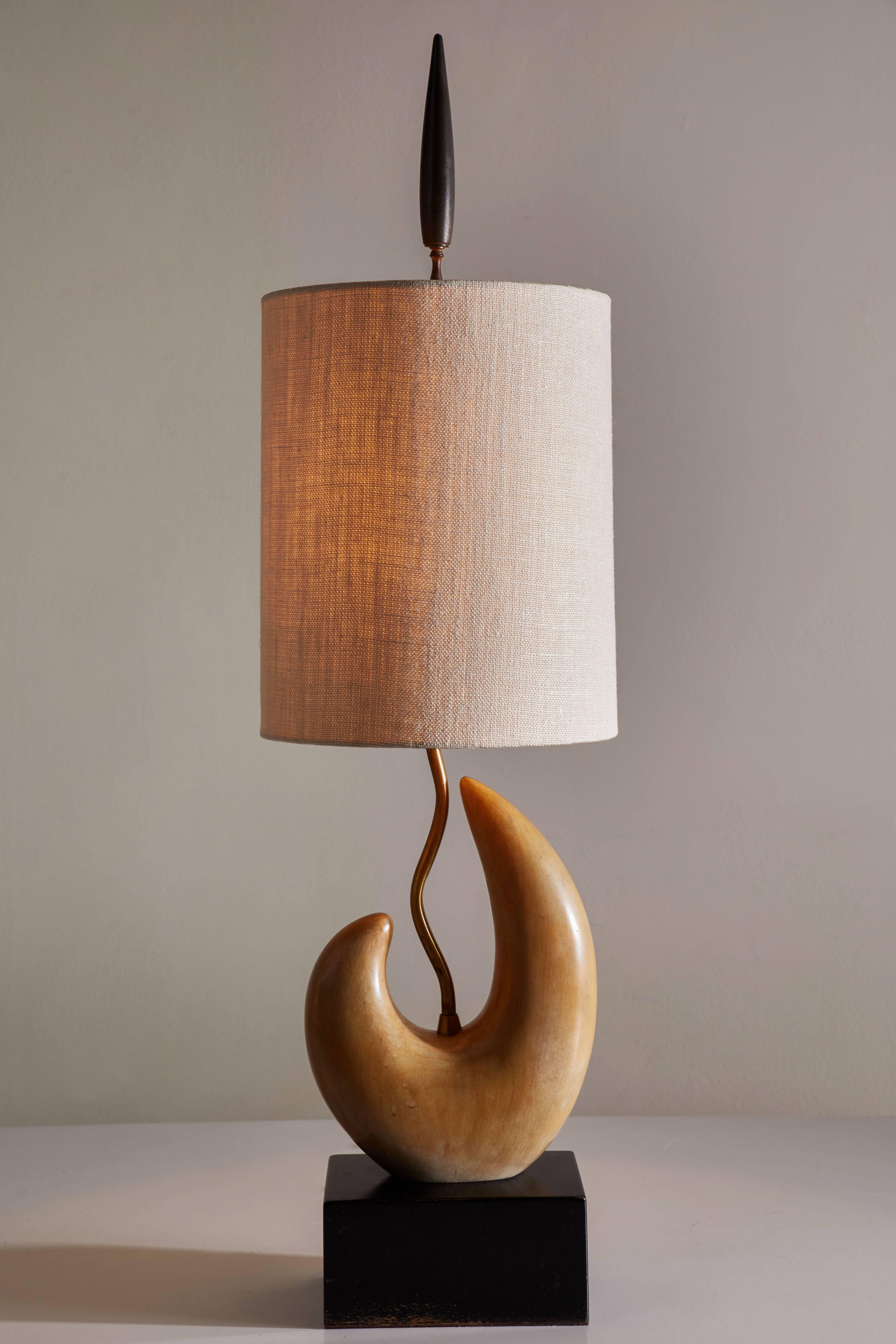 Rare table lamp by Yasha Heifetz designed in the US, circa 1950s. Original solid enameled wood base and lacquered sculptural wood form. Shade included with this fixture. Takes one E26 75w maximum bulb.