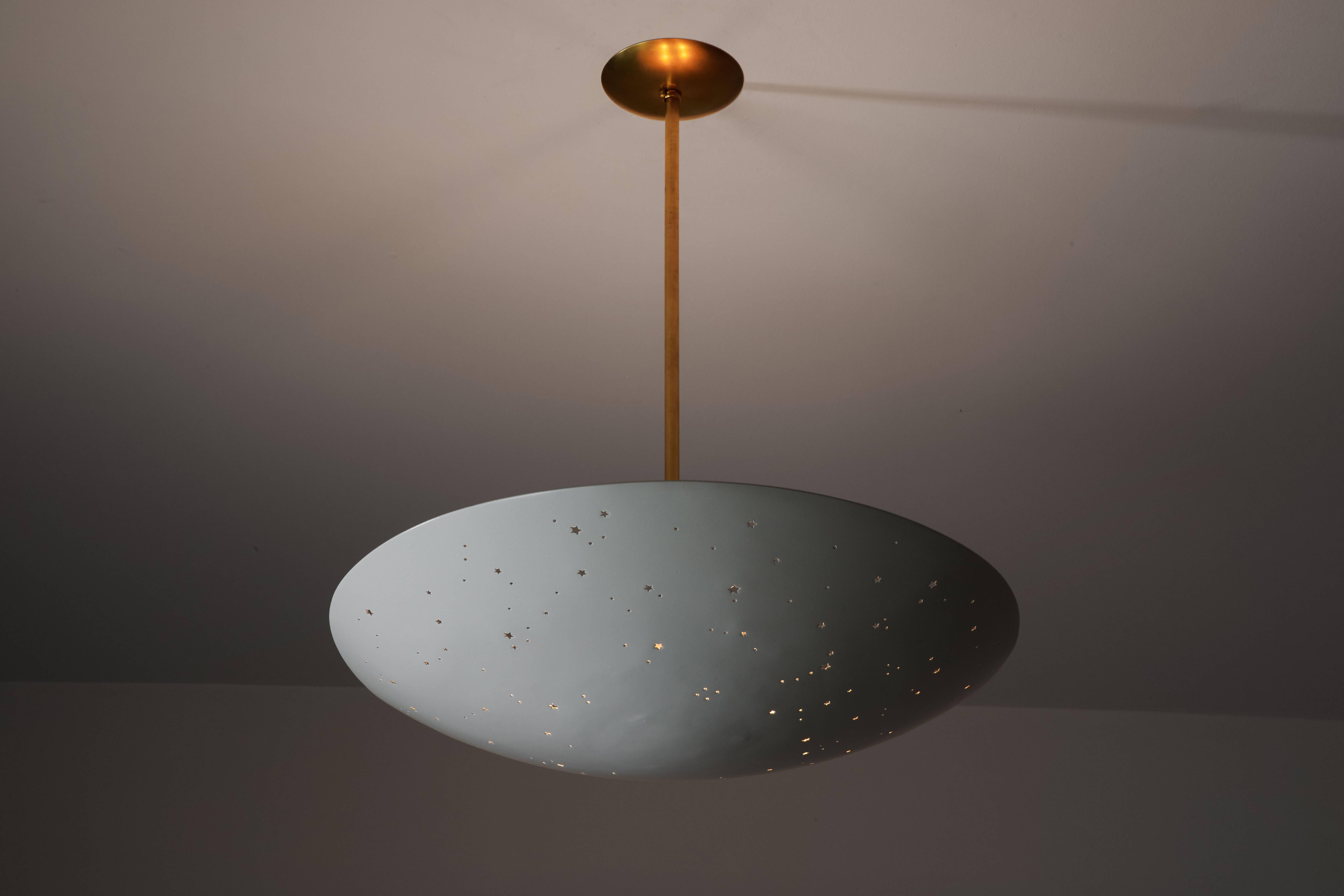Pendant light manufactured in Italy, circa 1950s. Restored, powder coated metal fixture with small star-shaped perforations. Brass hardware with custom brass backplate. Rewired for US junction boxes. Takes four E26 75w maximum bulbs. Overall drop
