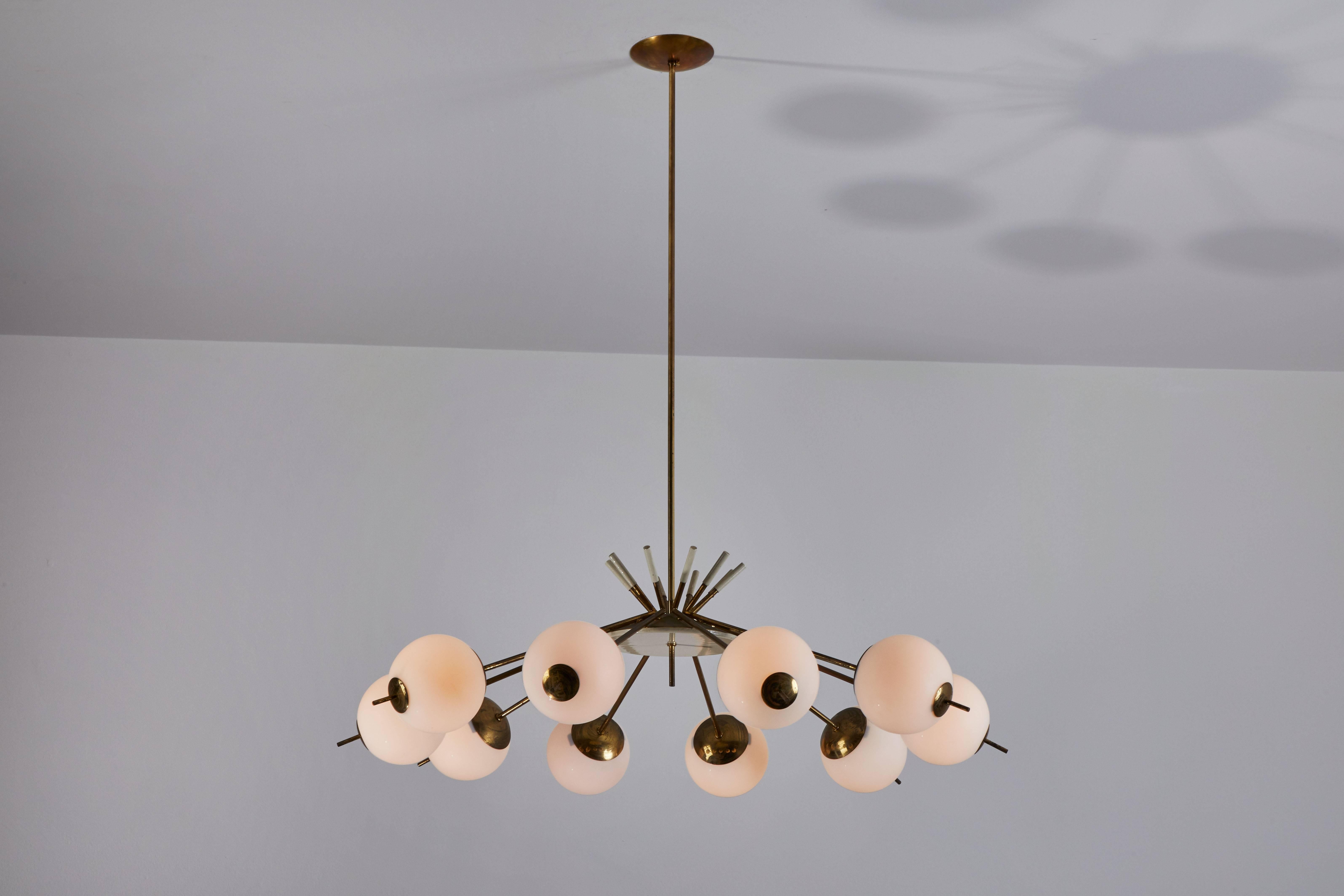 Ten globe chandelier attributed to Stilnovo. Manufactured in Italy, circa 1950s. Brushed satin glass globes, enameled metal with brass stem and hardware. Custom brass canopy. Rewired for US junction boxes. Each globe takes one E14 25w maximum bulb.