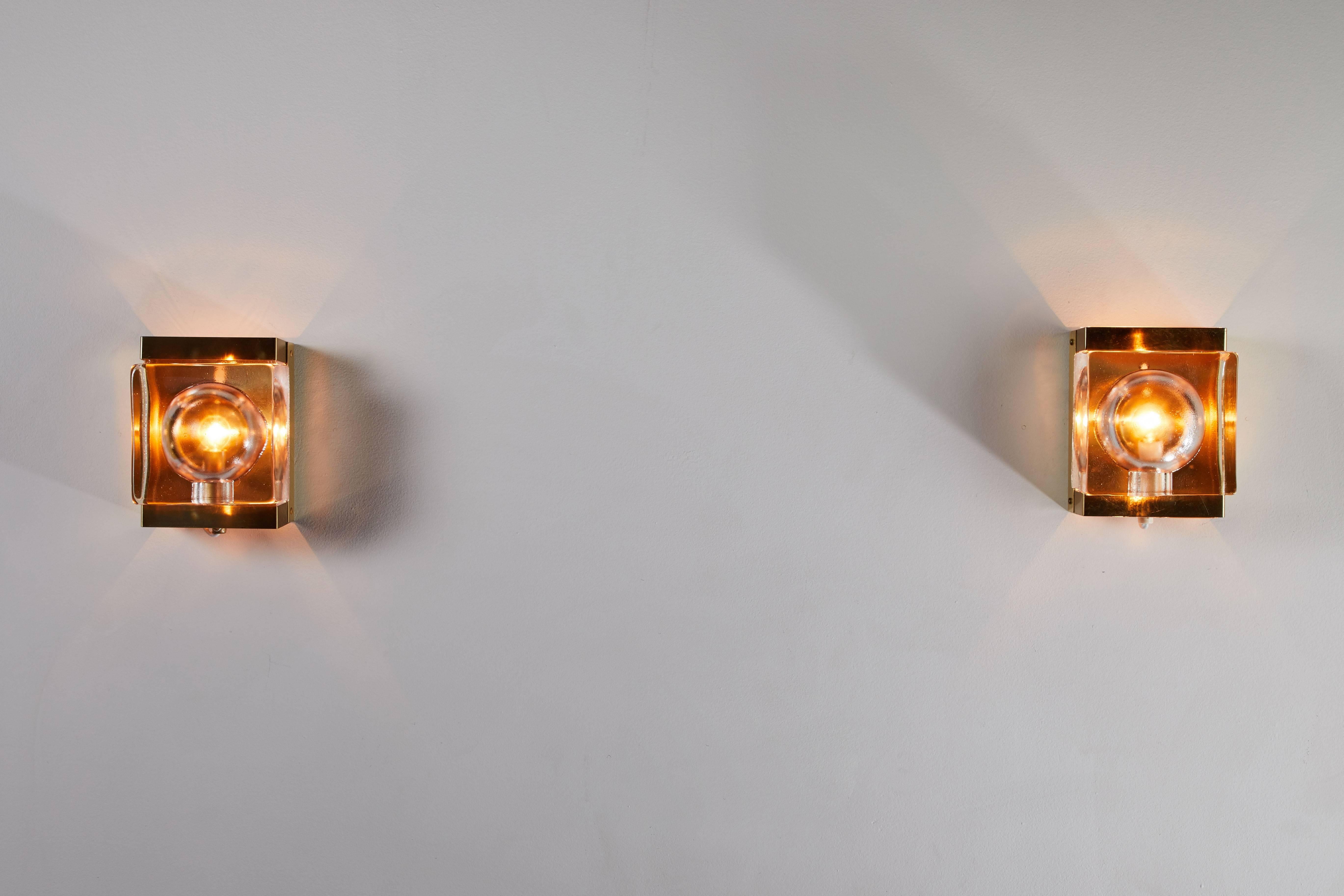 Two maritime style sconces manufactured by Vitrika in Denmark, circa 1960s. Brass and molded glass. Wired for US junction boxes. Maintains original manufacturer's label. Each sconce takes one E14 40w maximum bulb. Priced individually.