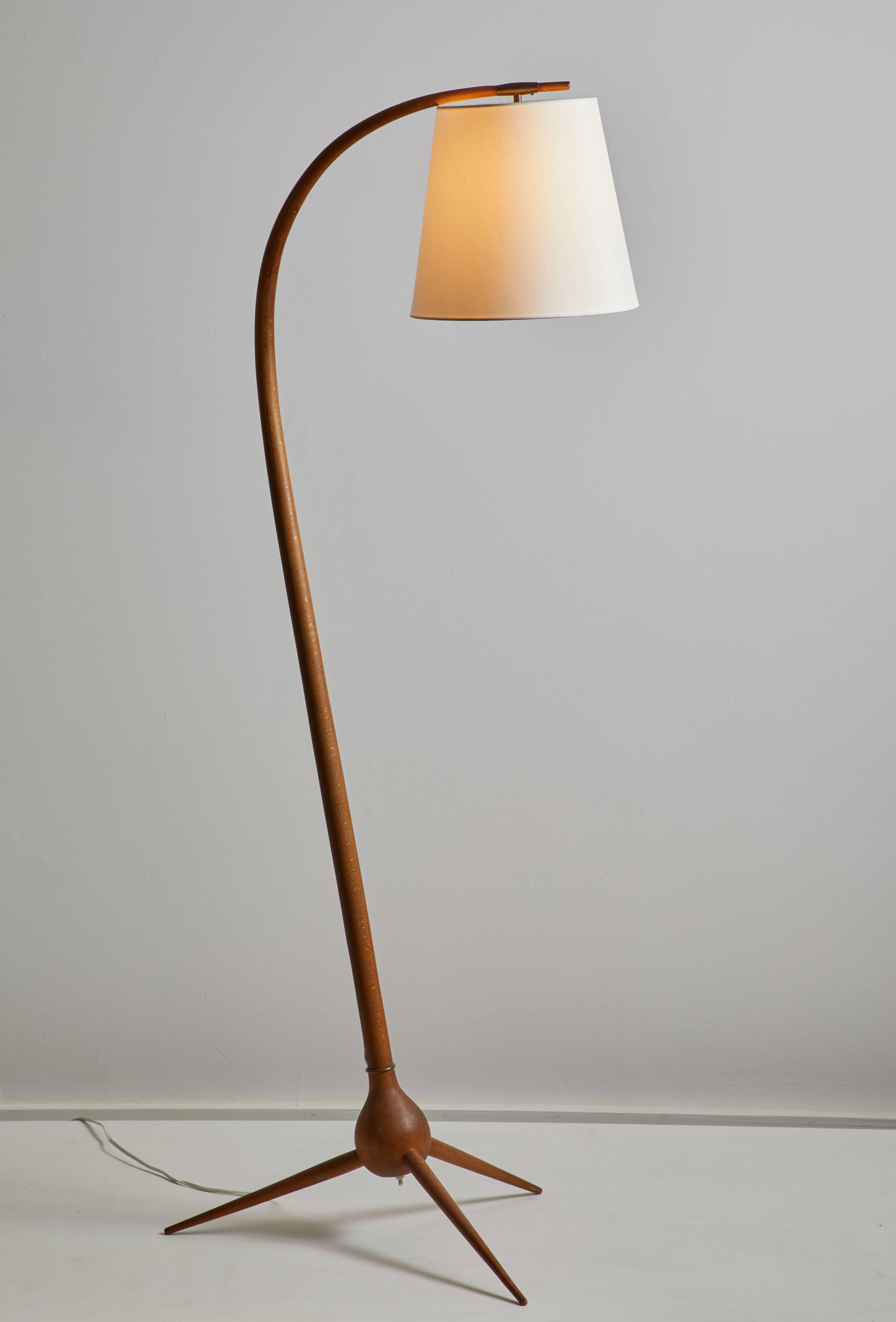 Bridge floor lamp by Severin Hansen Jr. Stained beech and brass. Curved stem on three-star foot base,  custom linen shade. Designed in Denmark, circa 1960s. Original cord. Takes an E27 100W maximum bulb.