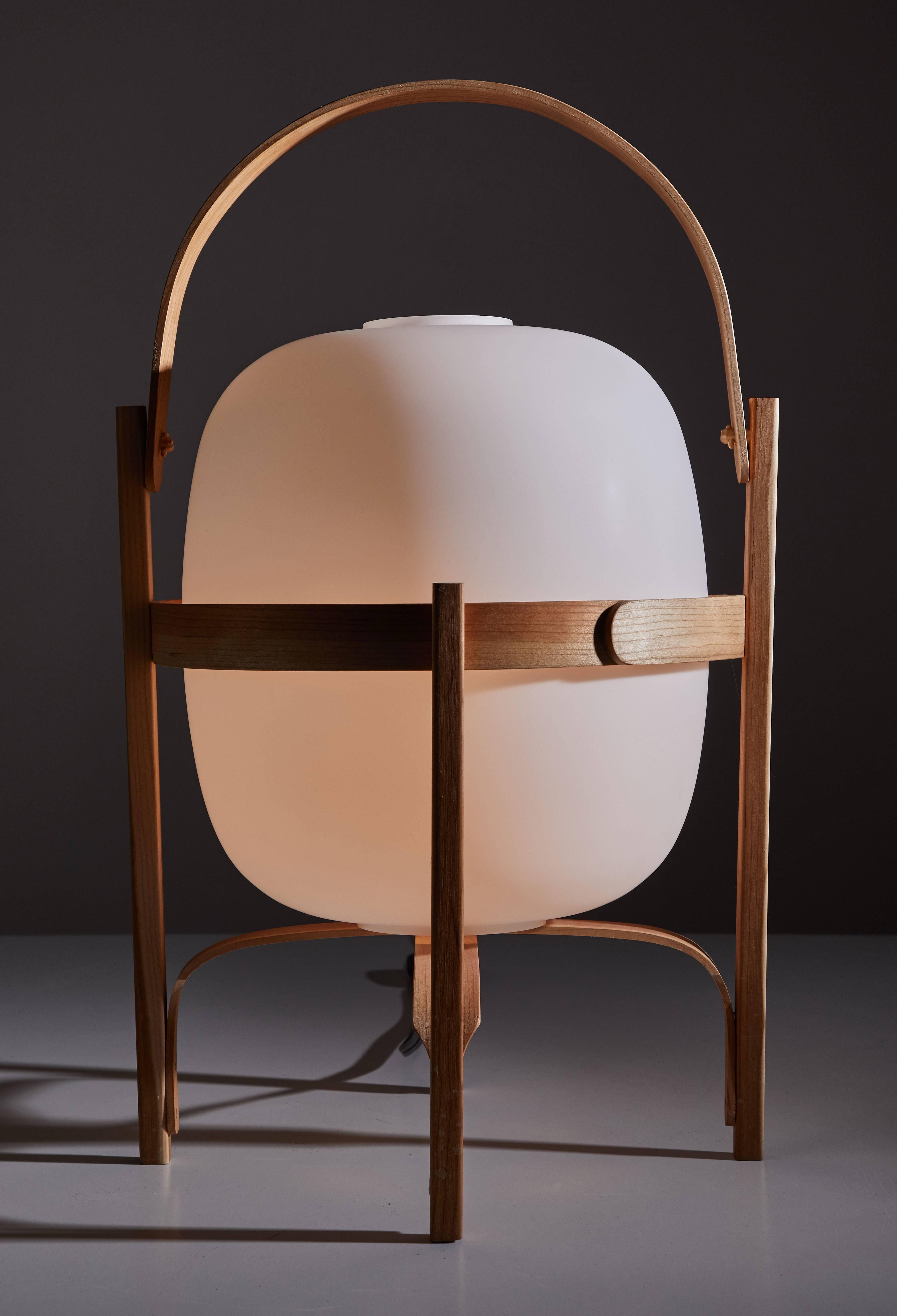 Cesta table lamp by Miguel Mila for Santa and Cole originally manufactured in 1962. This re-edition is a handcrafted lamp that has been shaped using traditional steam bending techniques and is delicately polished and sturdily put together. It