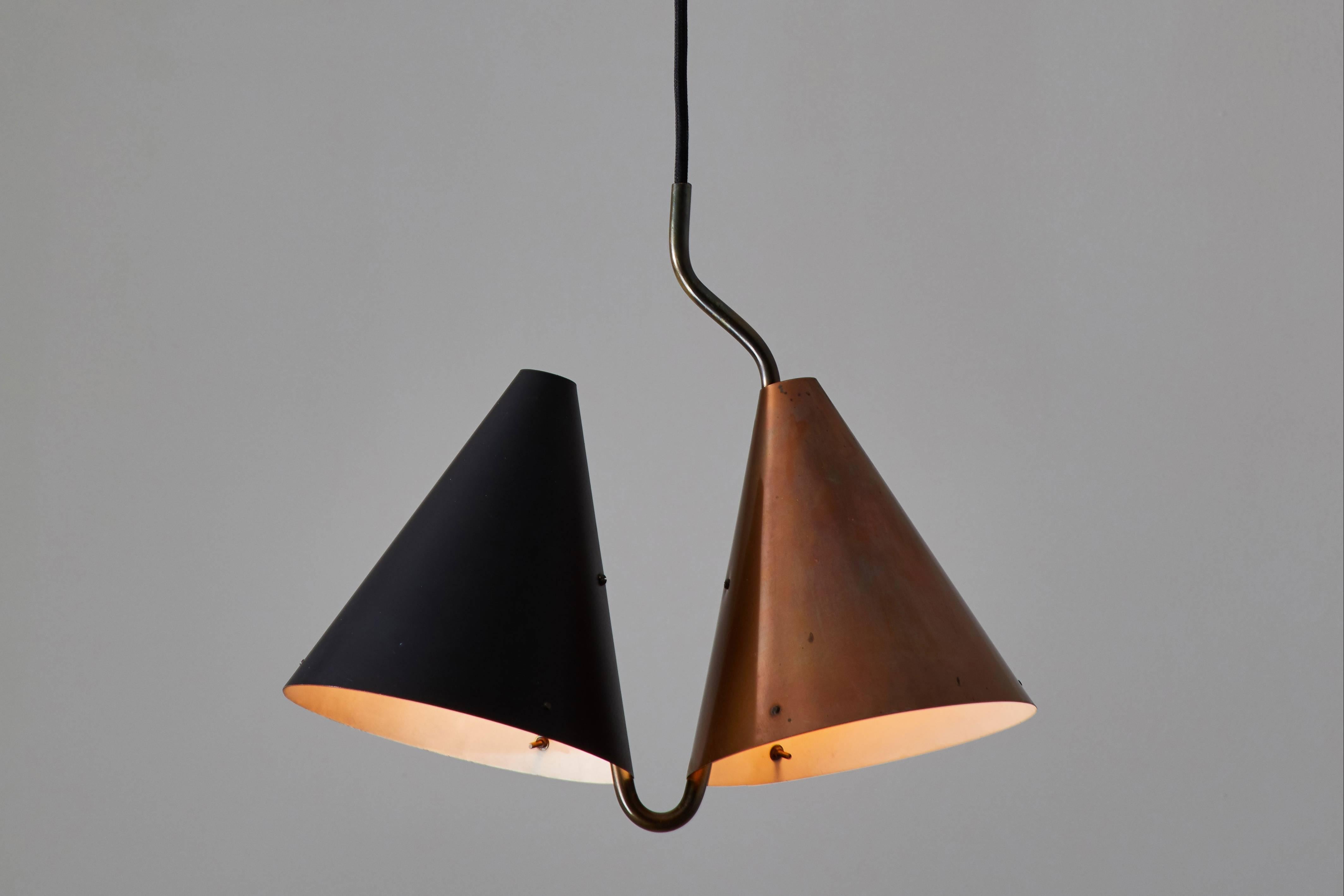 Rare double pendant lamp designed by Svend Aage Holm Sørensen, manufactured by Lyfa in Denmark in 1955. Enameled steel and copper plated brass. Wired for US junction boxes. Custom brass canopy. Takes two E-27 75w maximum bulbs