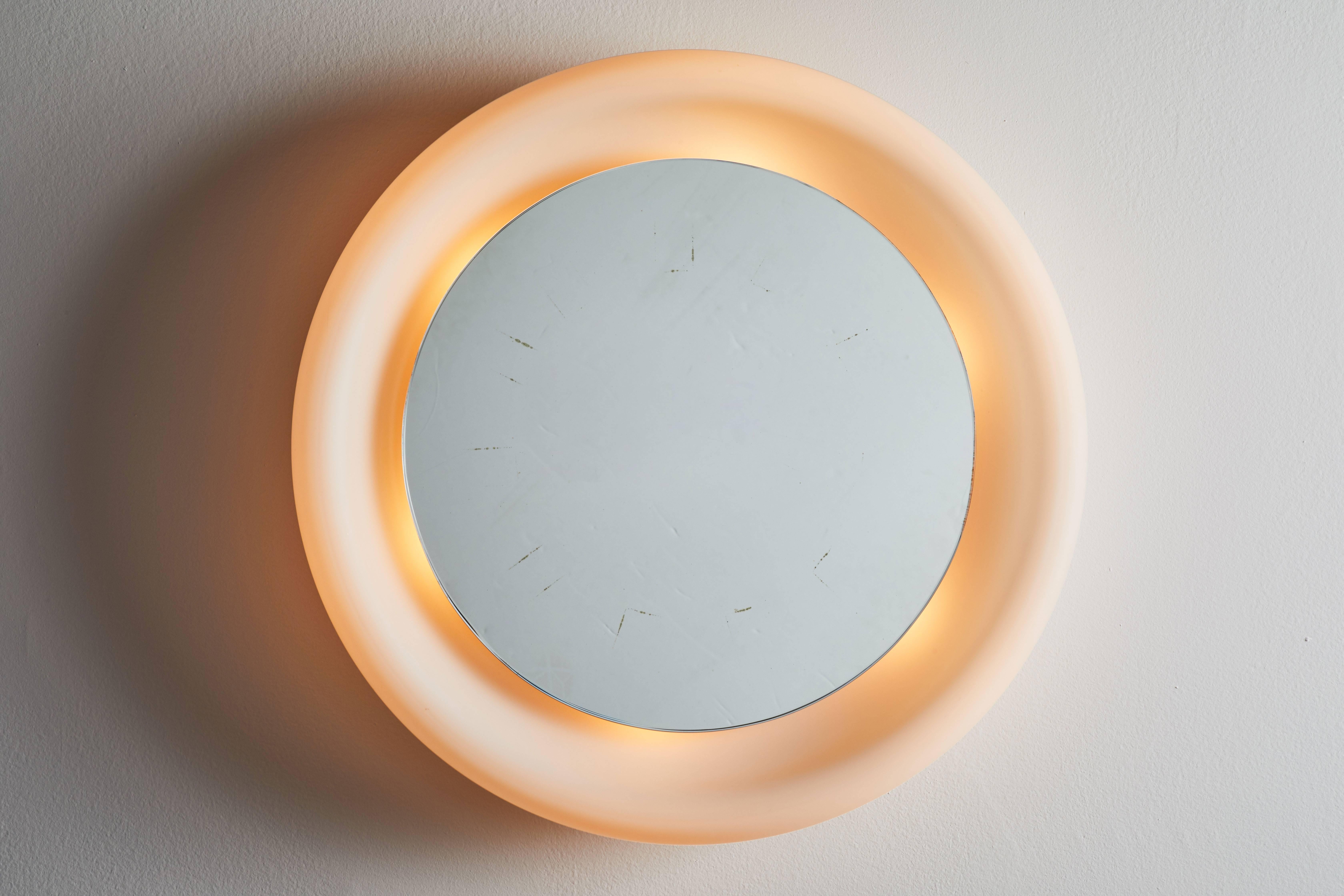 Luminous mirror designed by Gianna Celada for Fontana Arte in Italy, circa 1960s. Satin opal glass, polished and mirrored glass. Wired for US junction boxes. Takes one E27 100w maximum bulb. Literature: See: Fontana Arte. News '70, p. 55 (ceiling