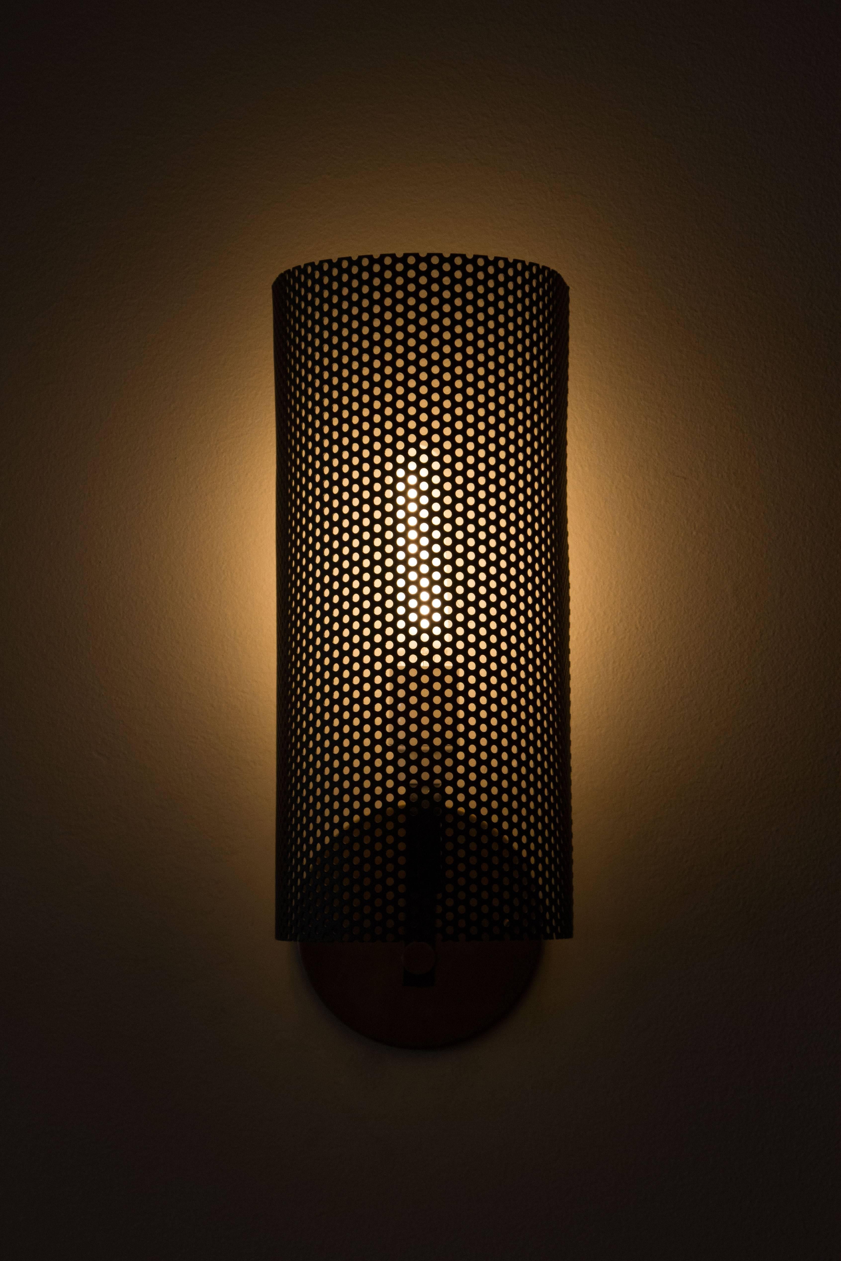 Fully restored perforated sconces.
    
    