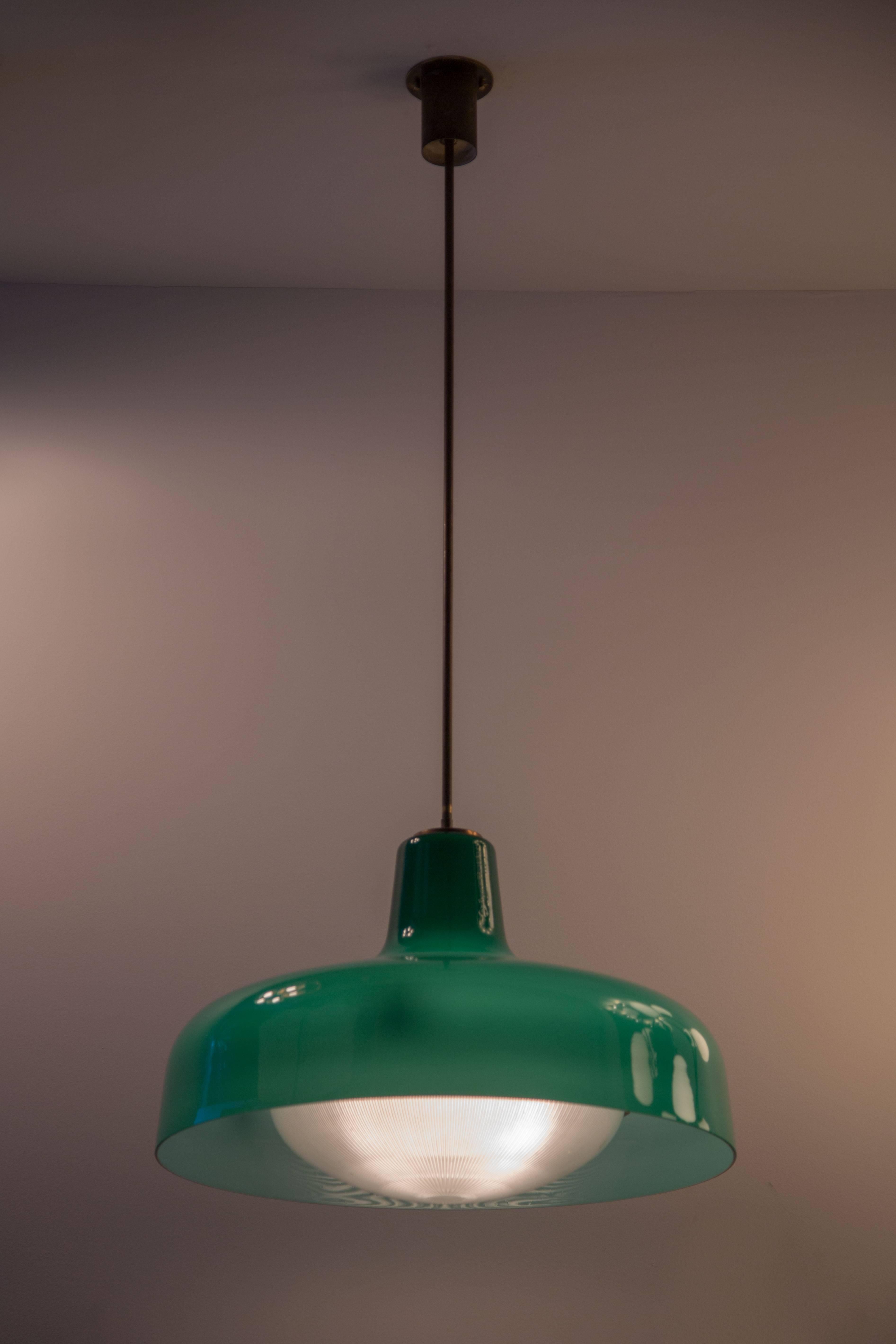 Green glass pendant with Holophane glass diffuser designed for Azucena.