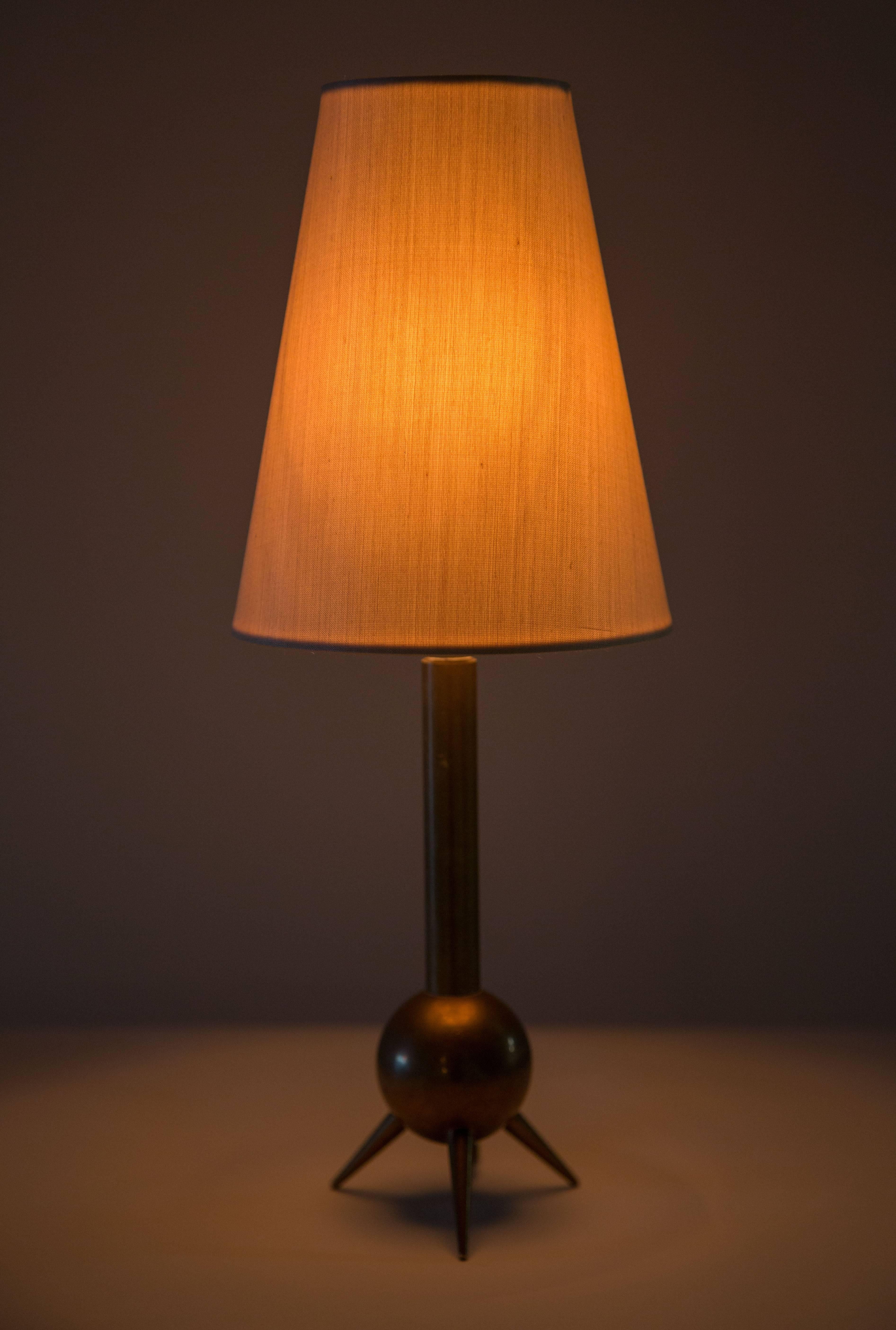 Petite table lamp made of solid bronze, custom silk shade.