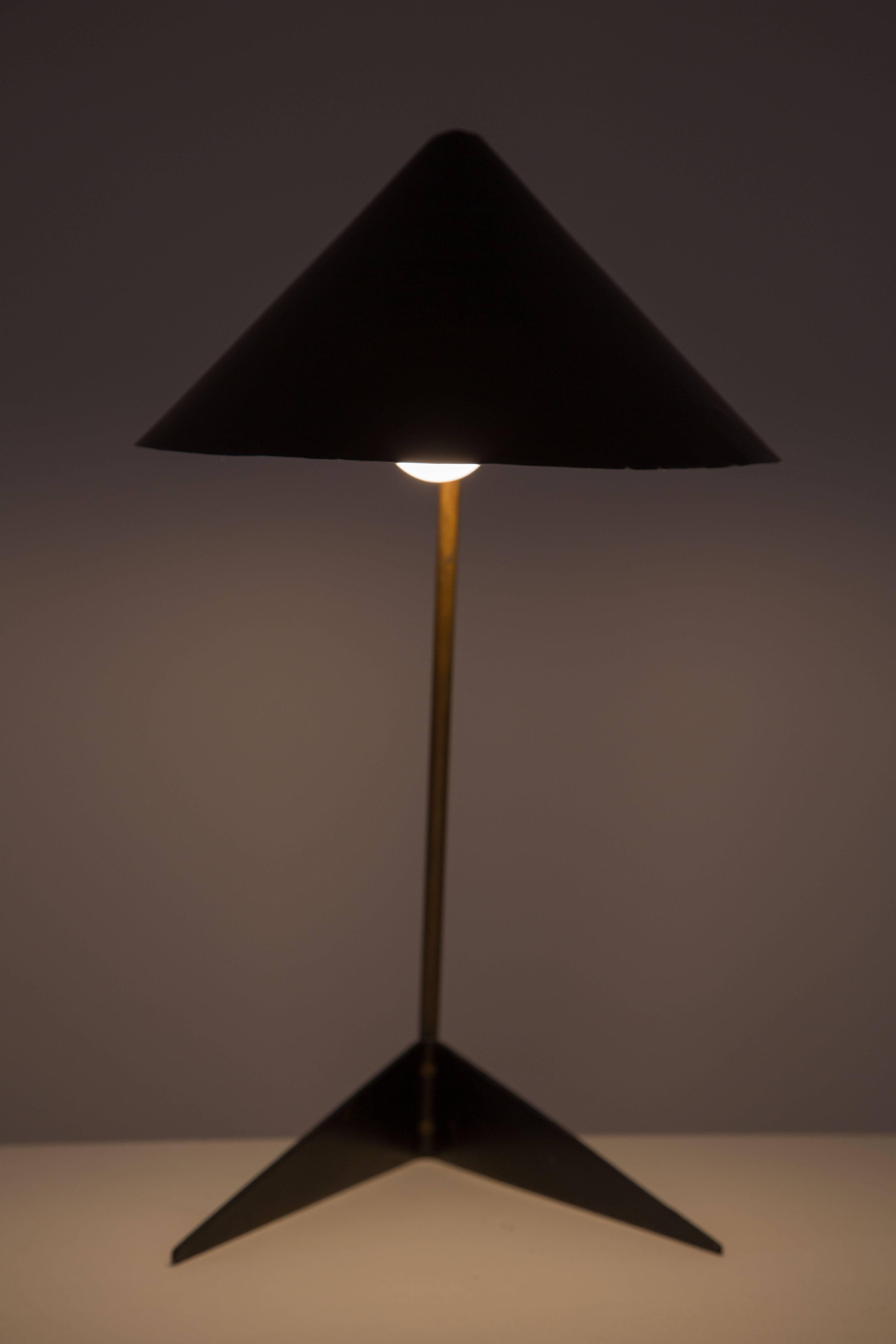 Brass and metal table lamp designed for RAAK. Adjustable shade, retains original label.