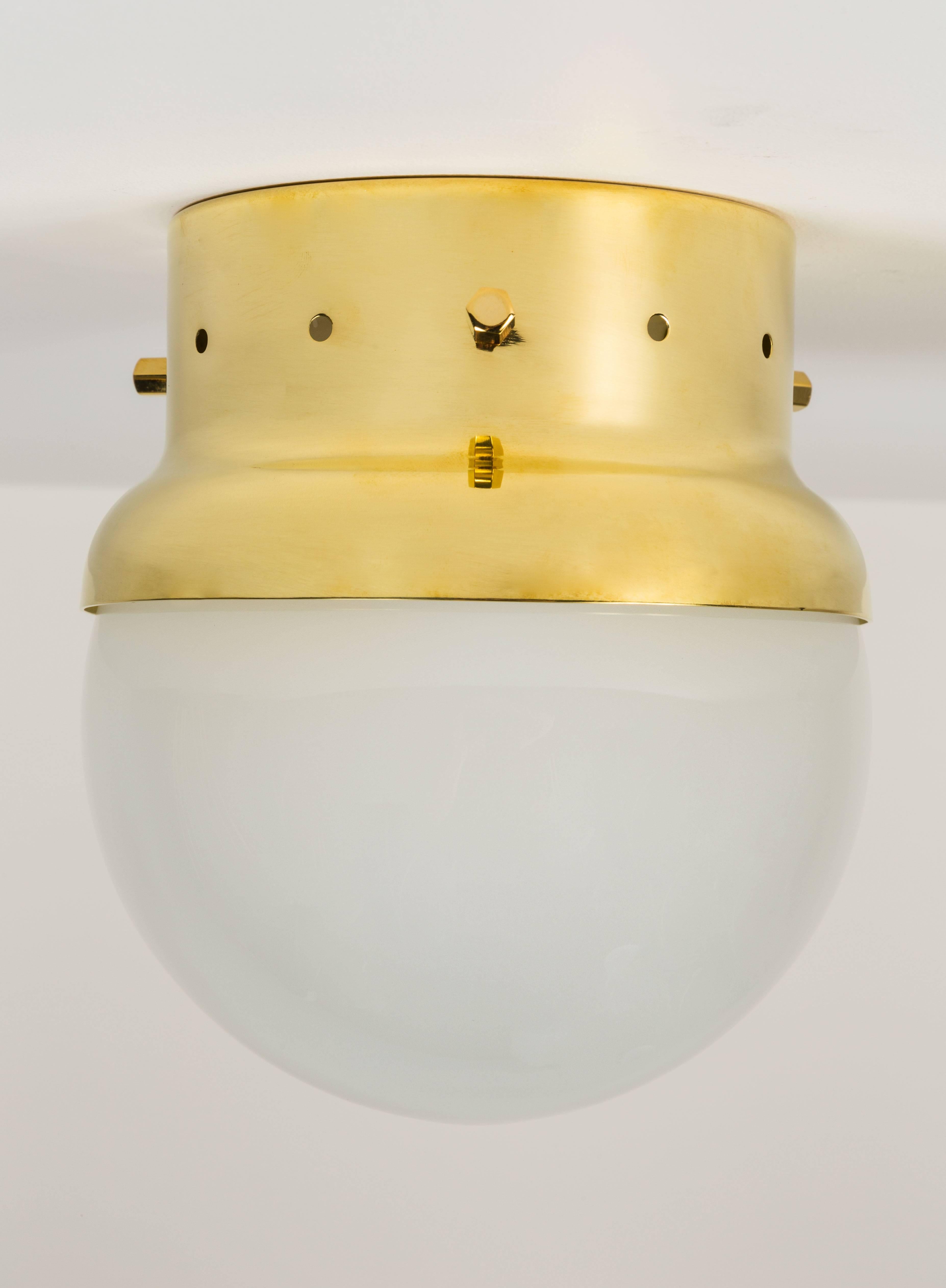 Model LSP16 Affogato Ceiling/ Wall Light designed by Azucena. Polished or natural brass, with frosted glass globe. Originally designed in 1998. 8-10 week lead. Wired for US junctin boxes. Takes one E27 100w maximum bulb
