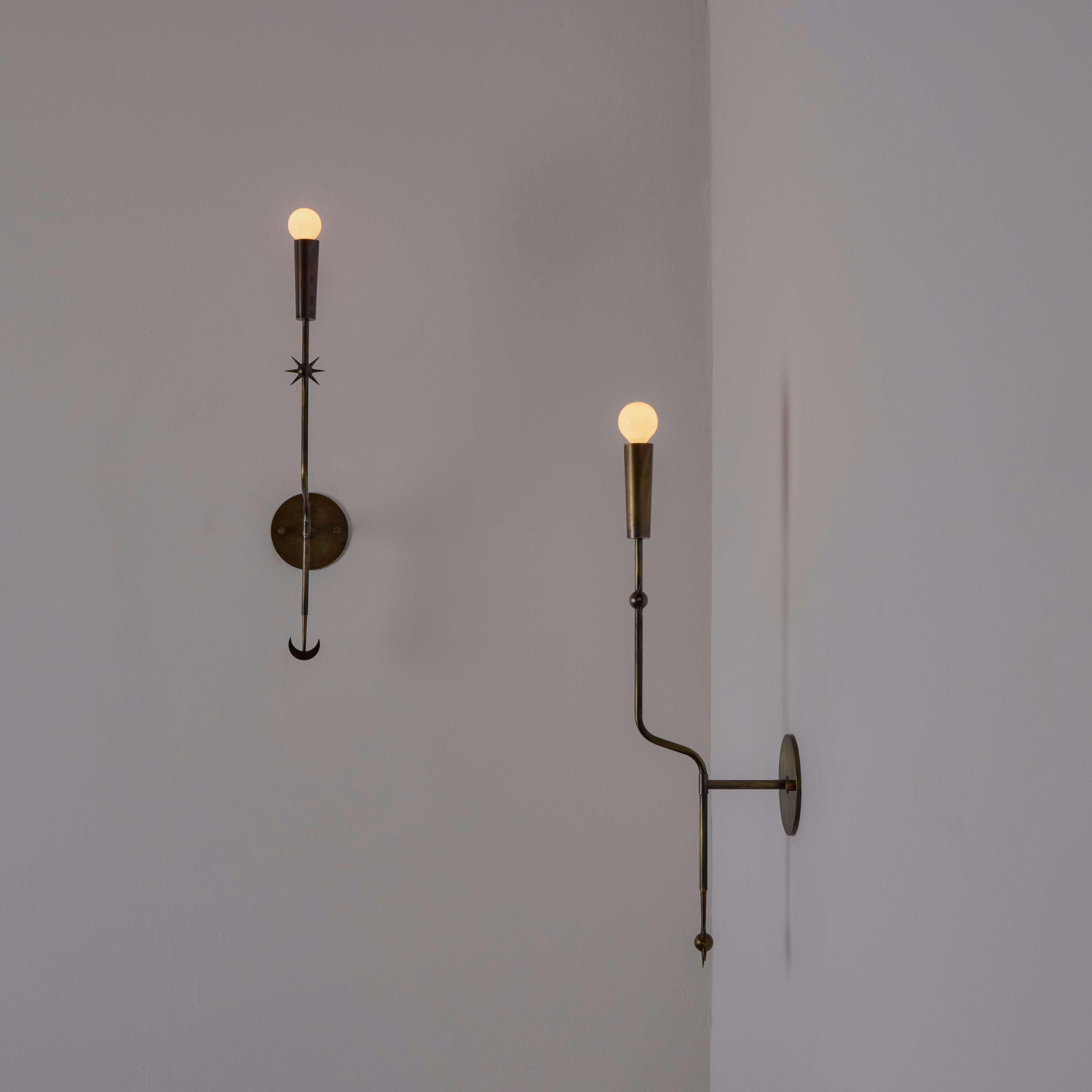 Rewire custom brass sconce in the style of Stilnovo. Star and Moon accents. Current production custom fabricated in Los Angeles by Rewire Gallery. You may choice any combination of star or moon bottom finials.

Antique brass finish, custom antique