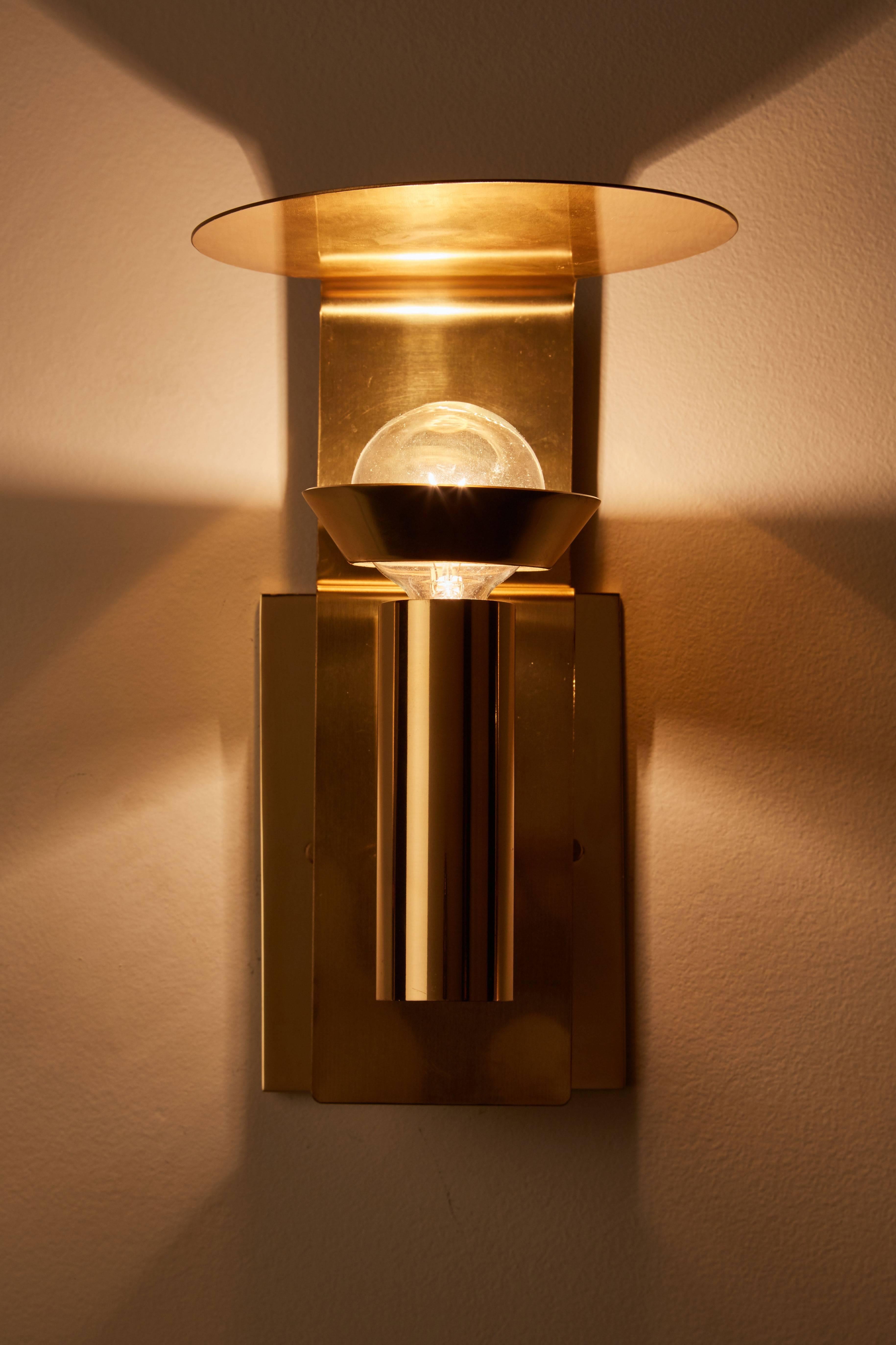 Four brass sconces manufactured by Focus Design in Sweden, circa 1960s. Wired for US junction boxes. Each sconce takes one E27 75w maximum bulb.