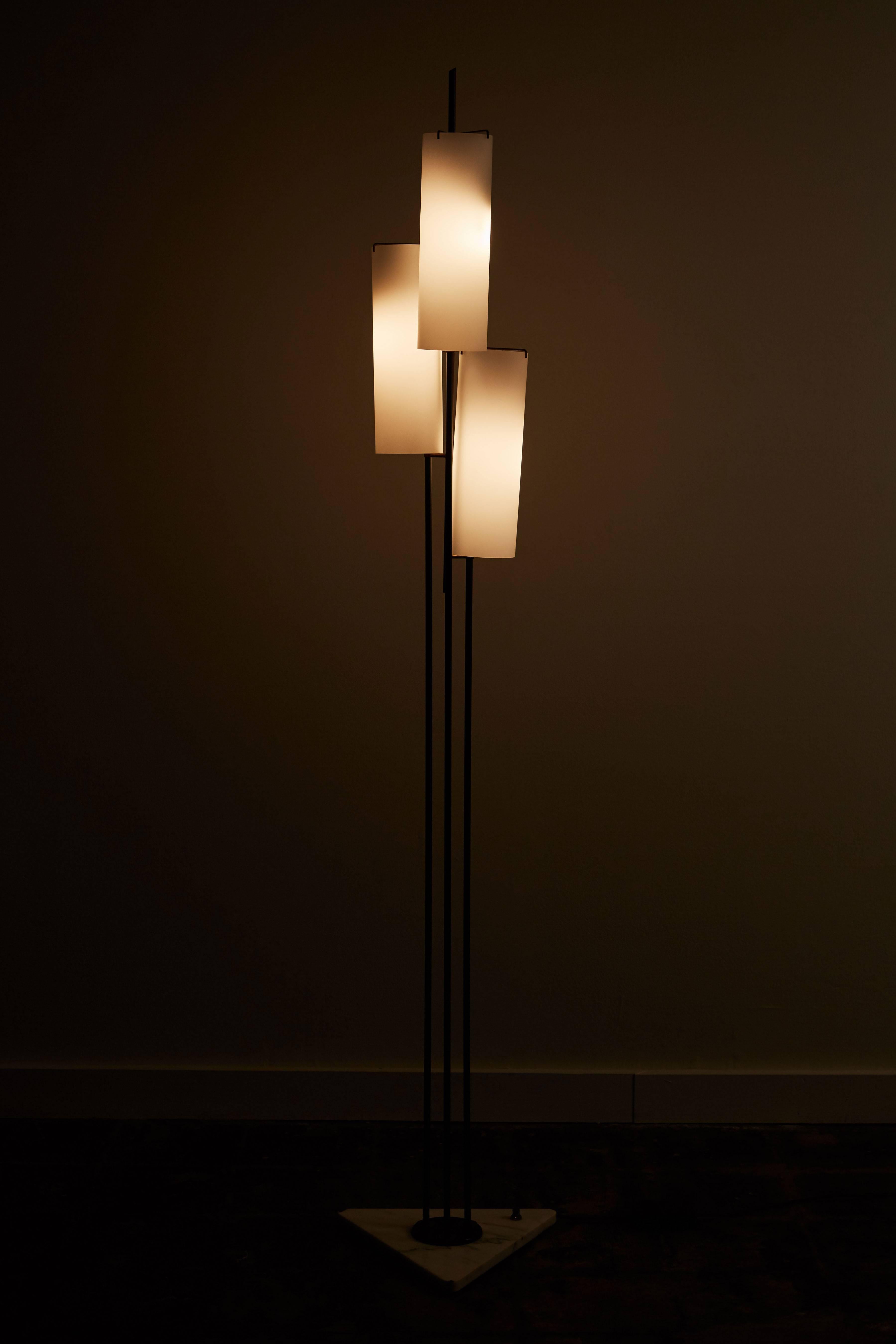 Three shade floor lamp by Stilnovo designed in Italy circa 1950s. Three brushed satin glass shades, metal stems and marble base, brass hardware. Wired for US sockets. Each shades takes one E27 60w maximum bulb.