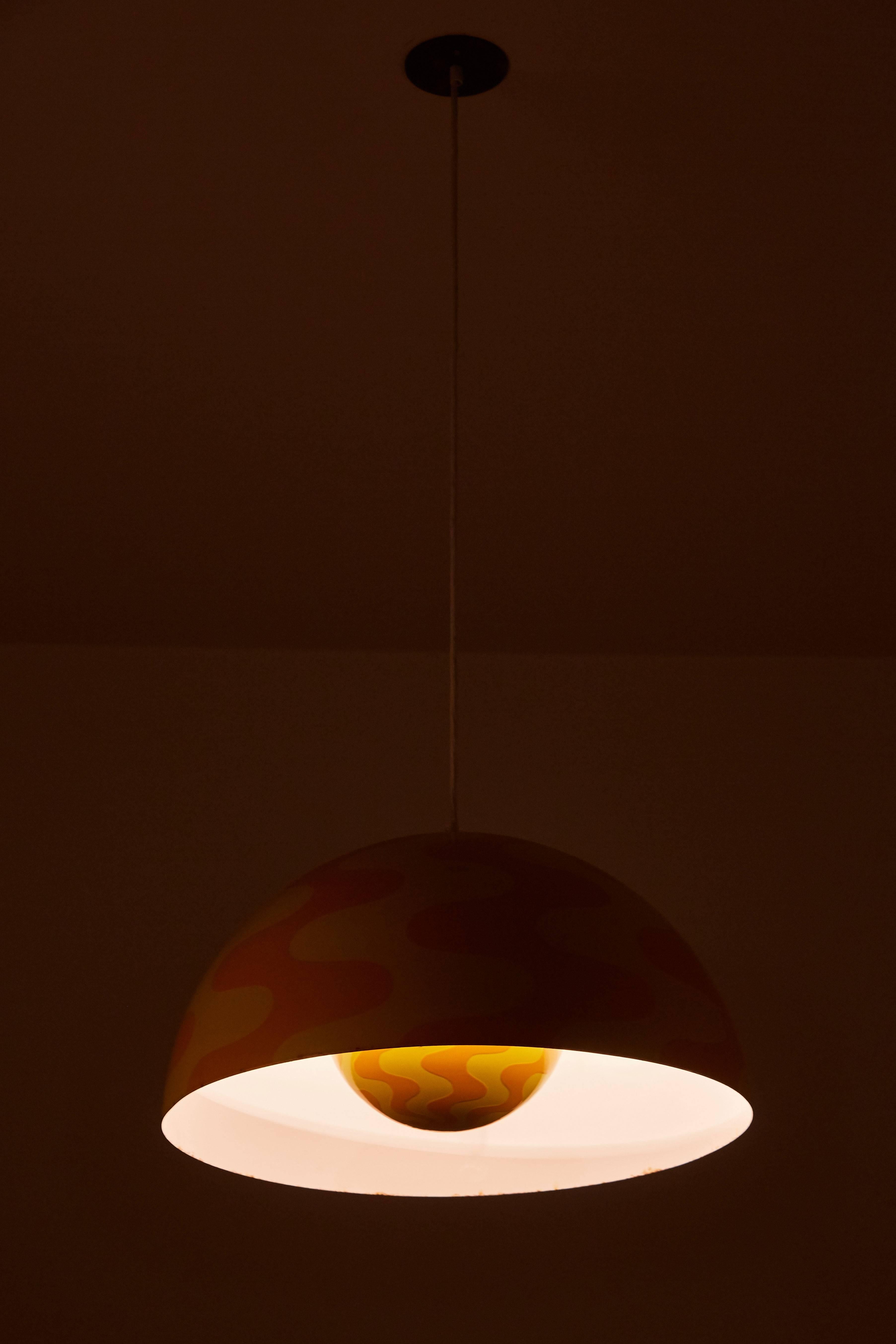 Rare large pendant with two diffusers, yellow and orange enameled pattern. Limited edition. Designed by Verner Panton for Louis Poulsen in 1971. Custom canopy. Wired for US junction boxes. Takes one E27 100w maximum bulb. Literature: Verner Panton -