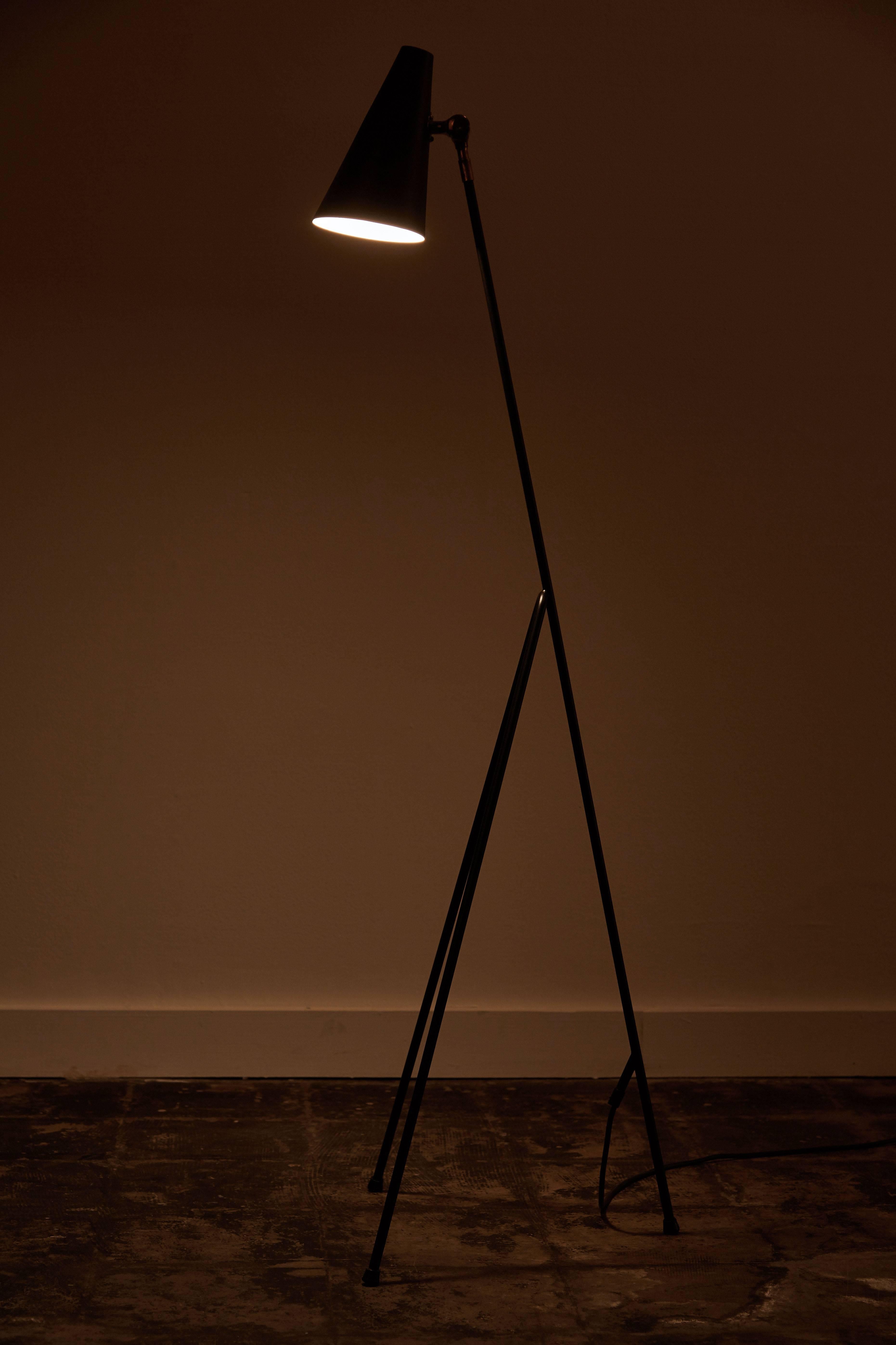 Three leg floor lamp with articulating shade. Designed in Sweden, circa 1950s. Shade articulates up or down with brass joint. Takes one E14 60w maximum bulb. Fully restored. Original cord.