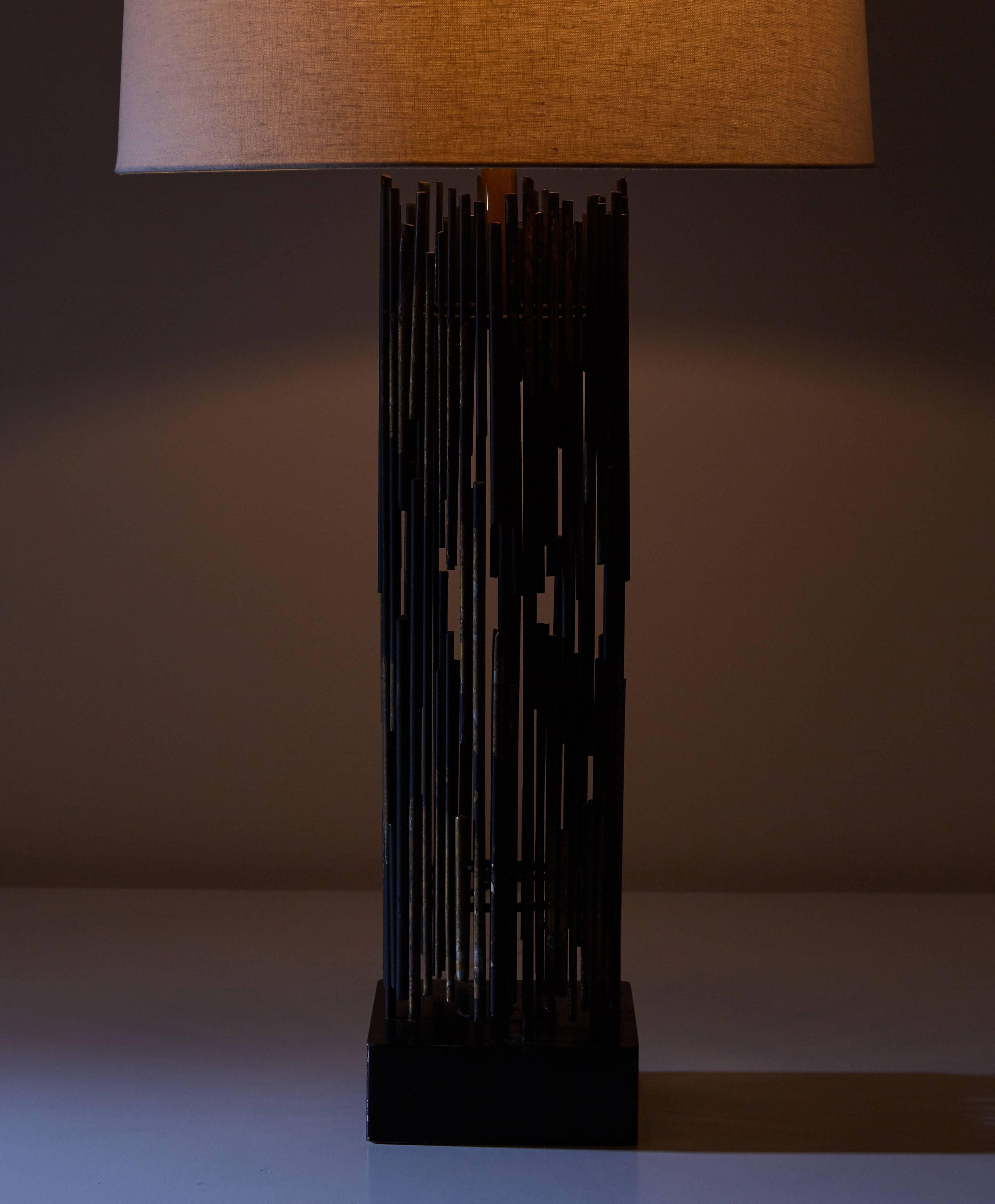 Iron table lamp by Kneedler-Fauchiere designed in the United States, circa 1960s. Welded iron rods with applied gold leaf and steel base. Rewired. Takes one E26 100w maximum bulb. Shade not included. Custom shade fabrication available.