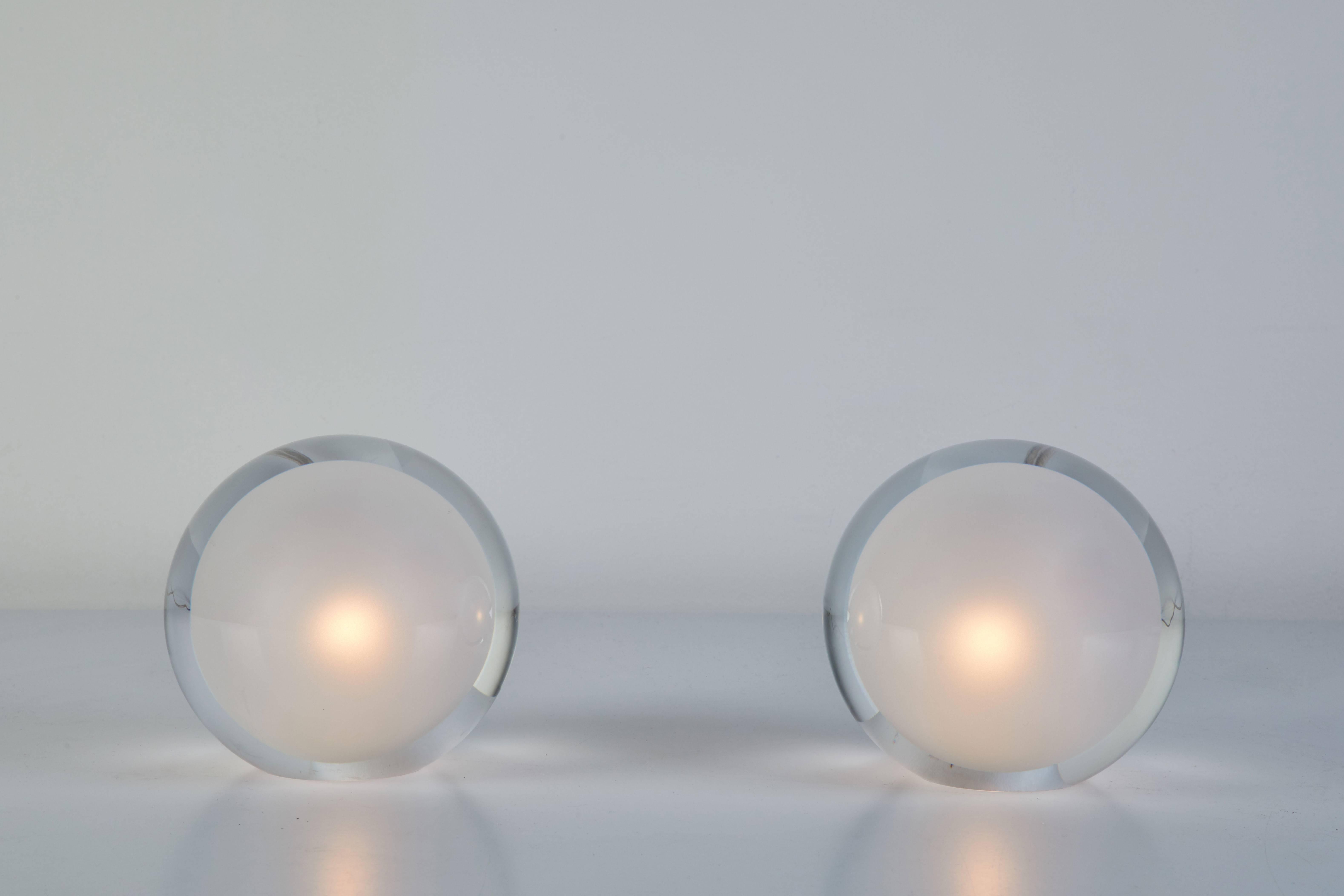 Teardrop table lamp by Tokujin Yoshioka designed for Yamagiwa in Japan. An orb of light floats within the transparent hard glass globe. Scaled to the size of a human heart, it is not a lighting fixture, but a design of light, itself. Part of the