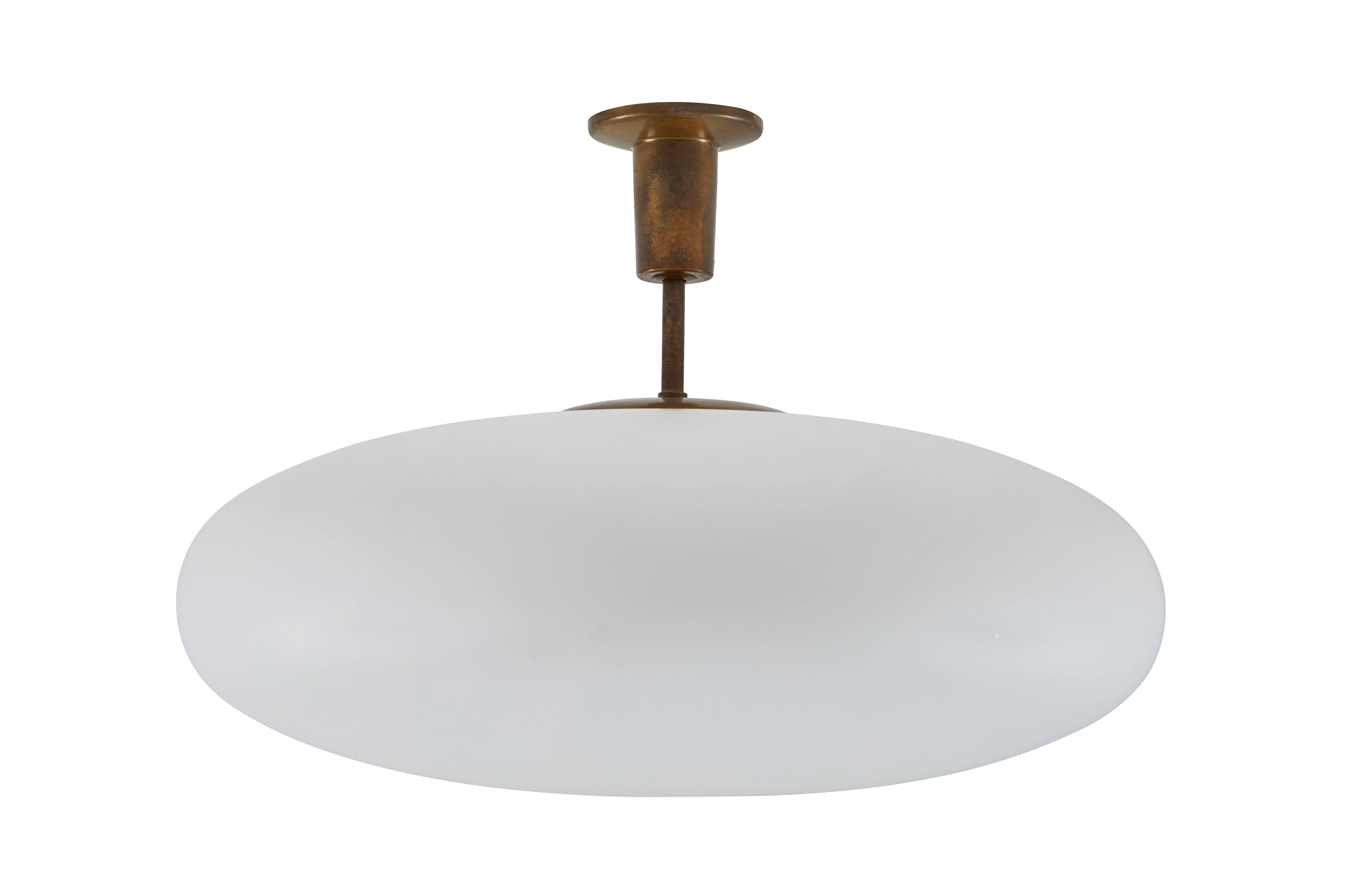 Flush mount ceiling lamp by Angelo Lelli for Arredoluce designed in Italy, 1955. Polished brass, opal glass. Certification from Archivio Arredoluce. Custom brass canopy. Wired for US junction boxes. Takes one E27 100w maximum bulb .

 