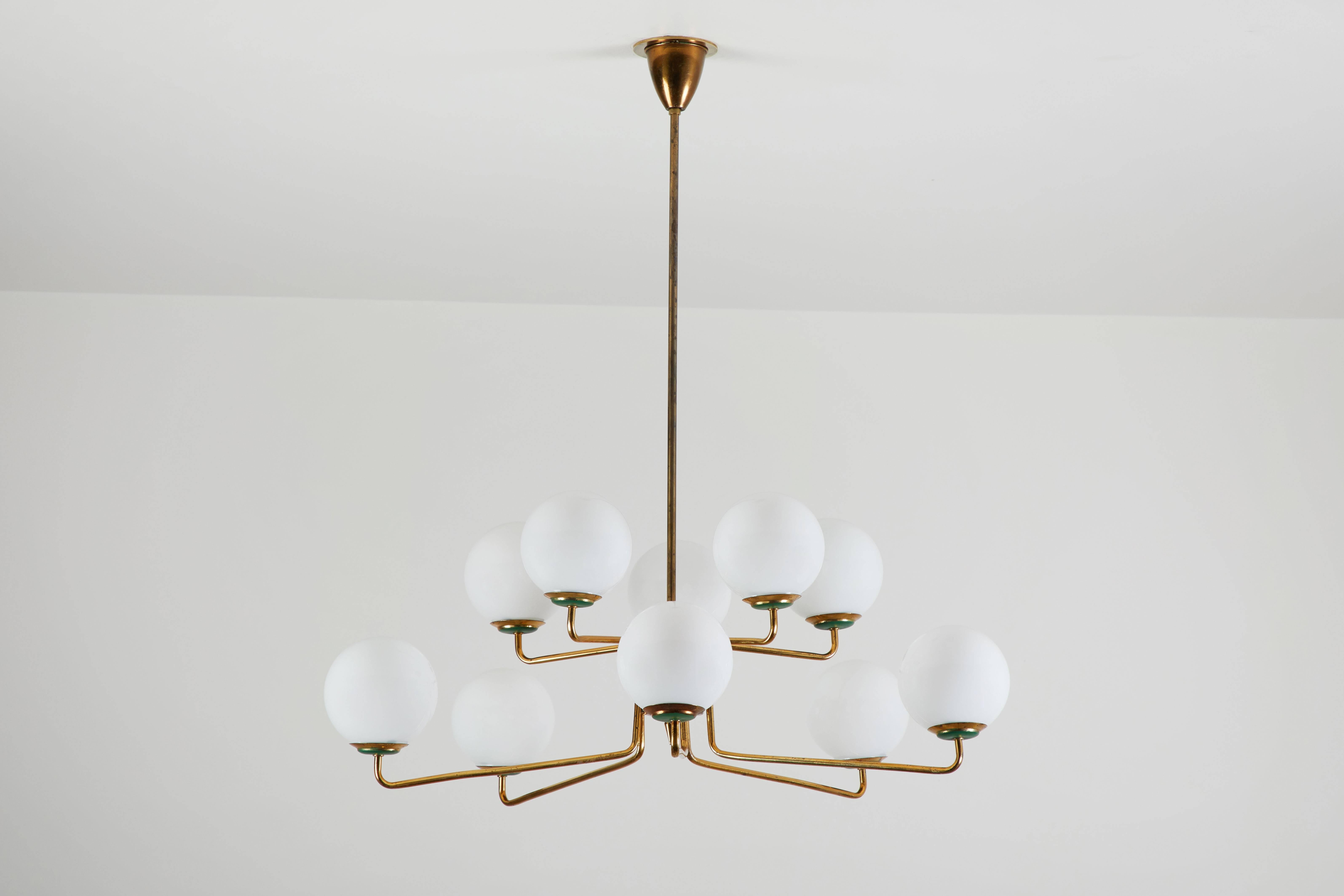 Stilnovo chandelier
Polished brass and opaline glass
Rewired for US junction box ten 25w E-14.