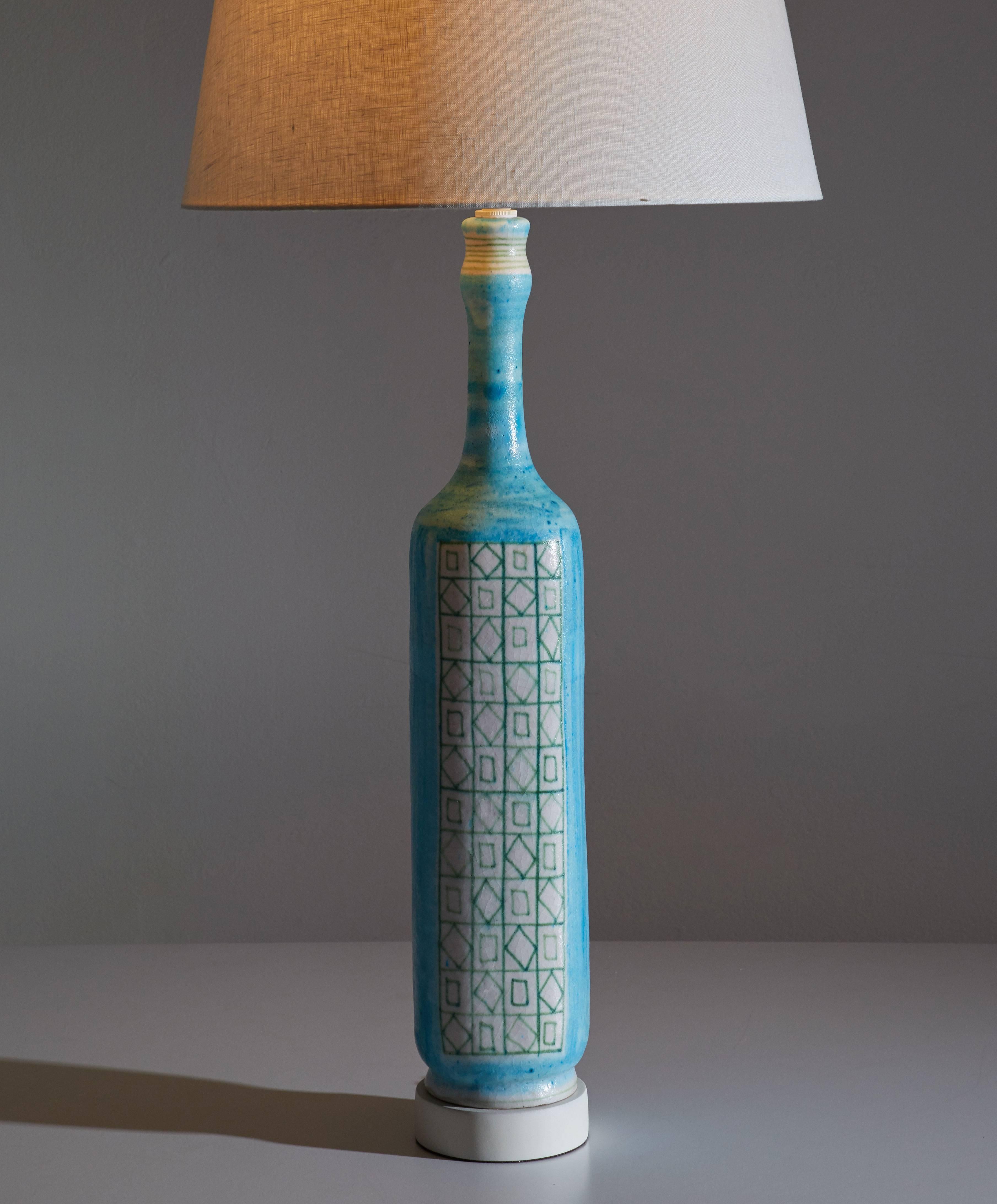 Guido Gambone table lamp.
Italian 1950s handmade Ceramic with painted wood and brass base. Signature on base
One 75w E-26.

