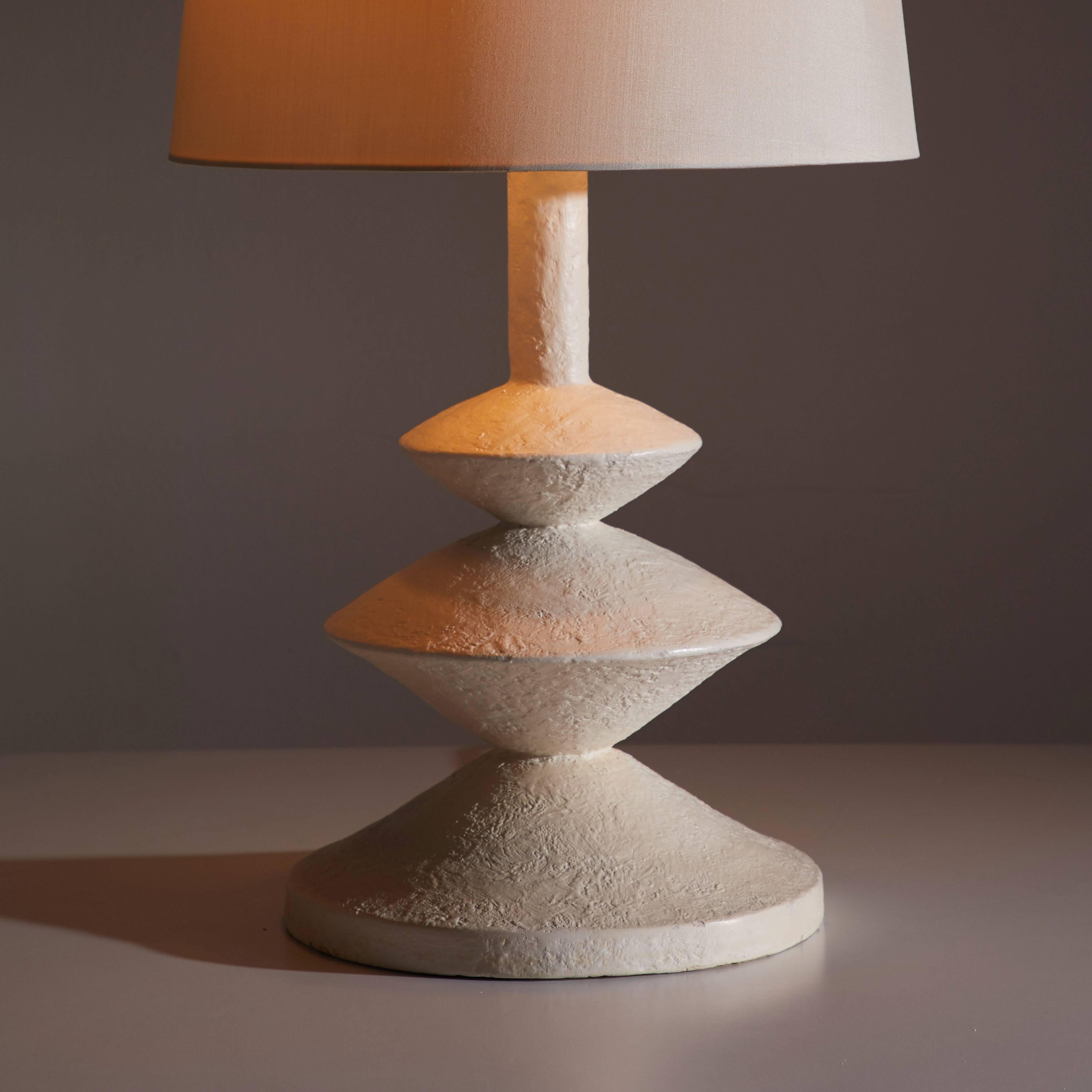 Single table lamp after Jean Michel Frank and Giacometti for Sirmos.
Manufactured in New York, circa 1970s. Original cord. Shade for display purposes only, not included. Custom shade fabrication available. Two 75w E-26.