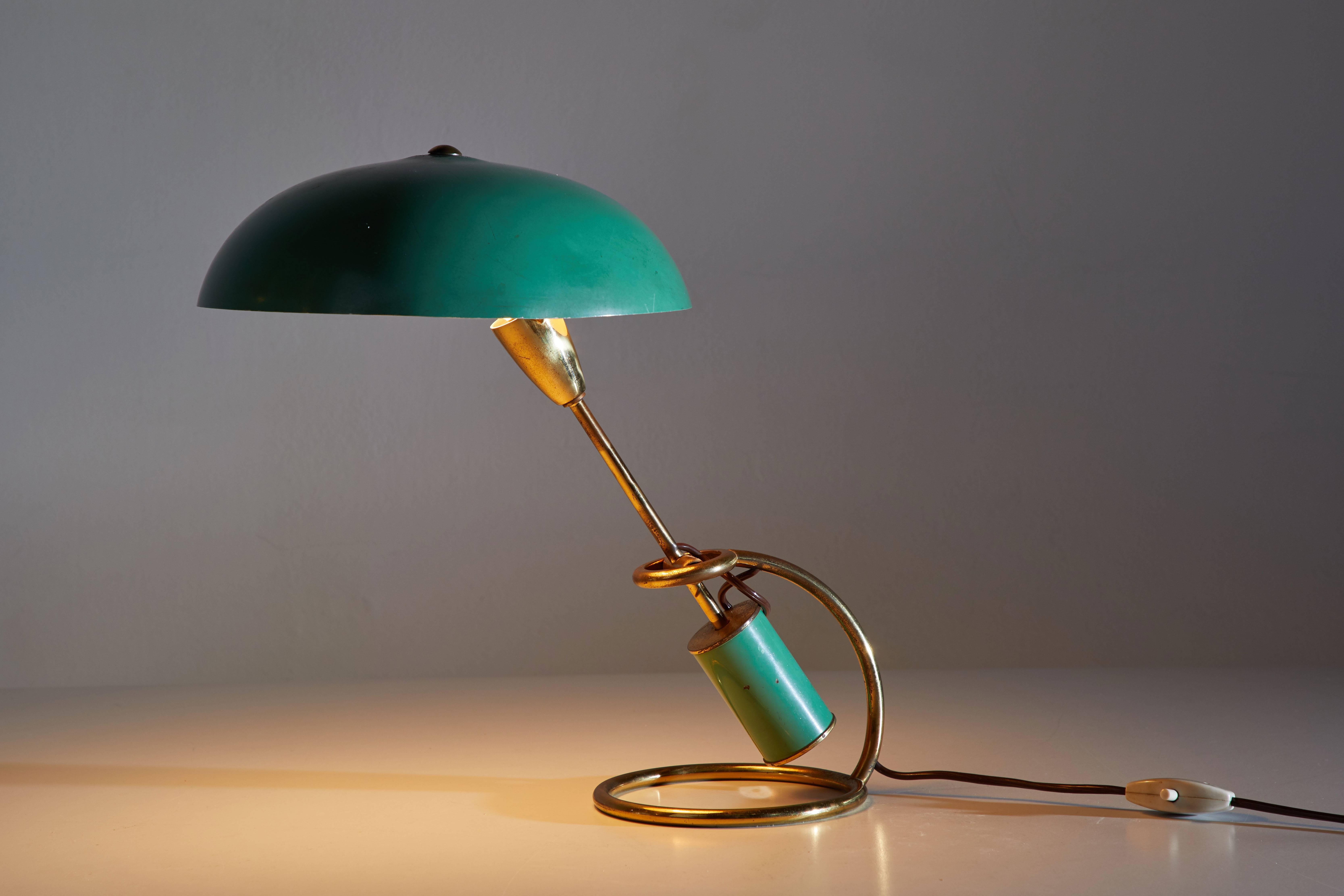 Table lamp designed by Angelo Lelli for Arredoluce in Italy, circa 1950s. Brass and enameled metal. Original enamel color. Original cord. Retains original manufacturer's stamp to base. Takes one E14 60w maximum bulb.