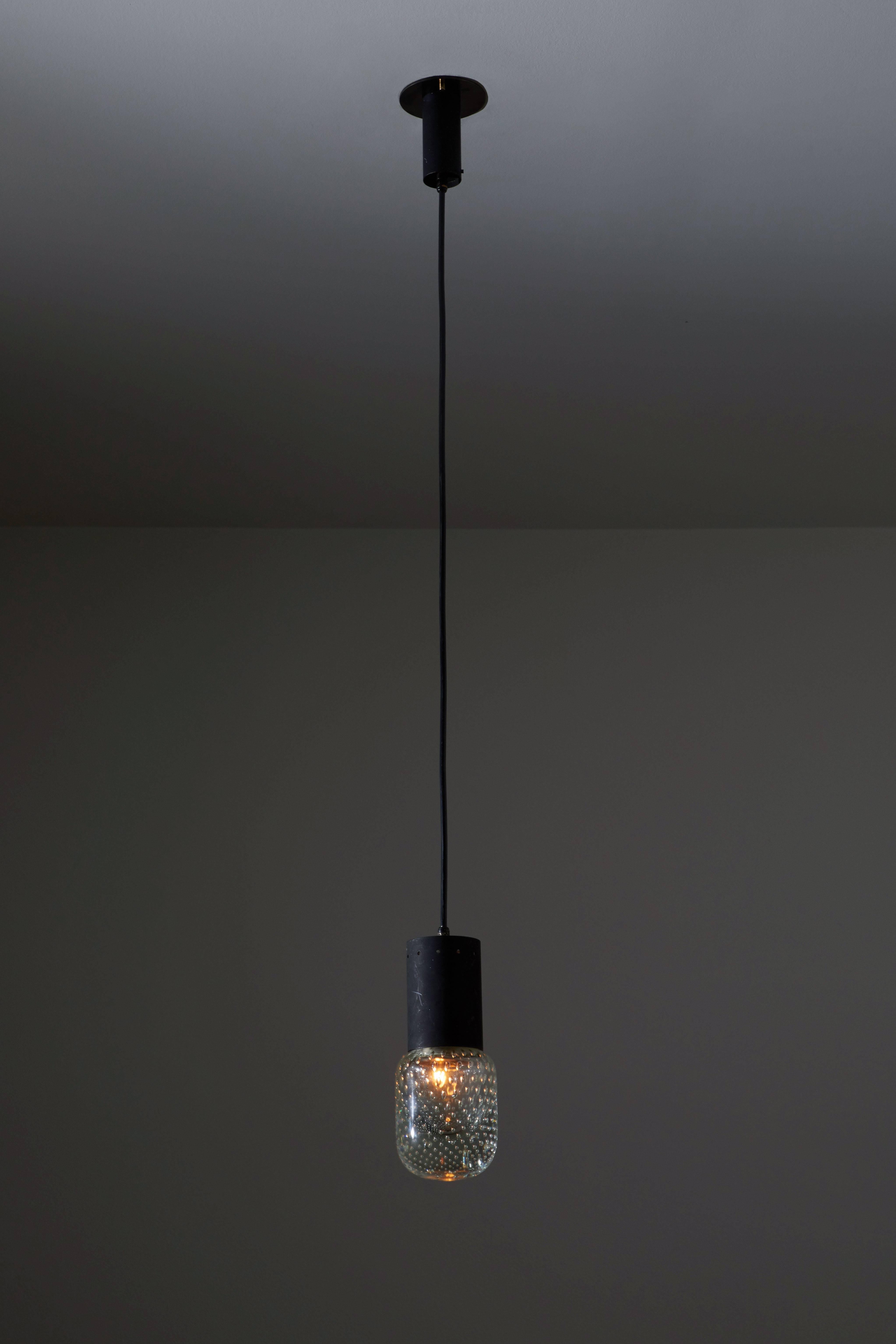 Three pendants designed by Gino Sarfatti, manufactured by Arteluce in Italy, circa 1960s. Original Seguso controlled bubble glass and metal. Wired for US junction boxes. Pendants overall drop can be customized. Each light takes one E14 60w maximum