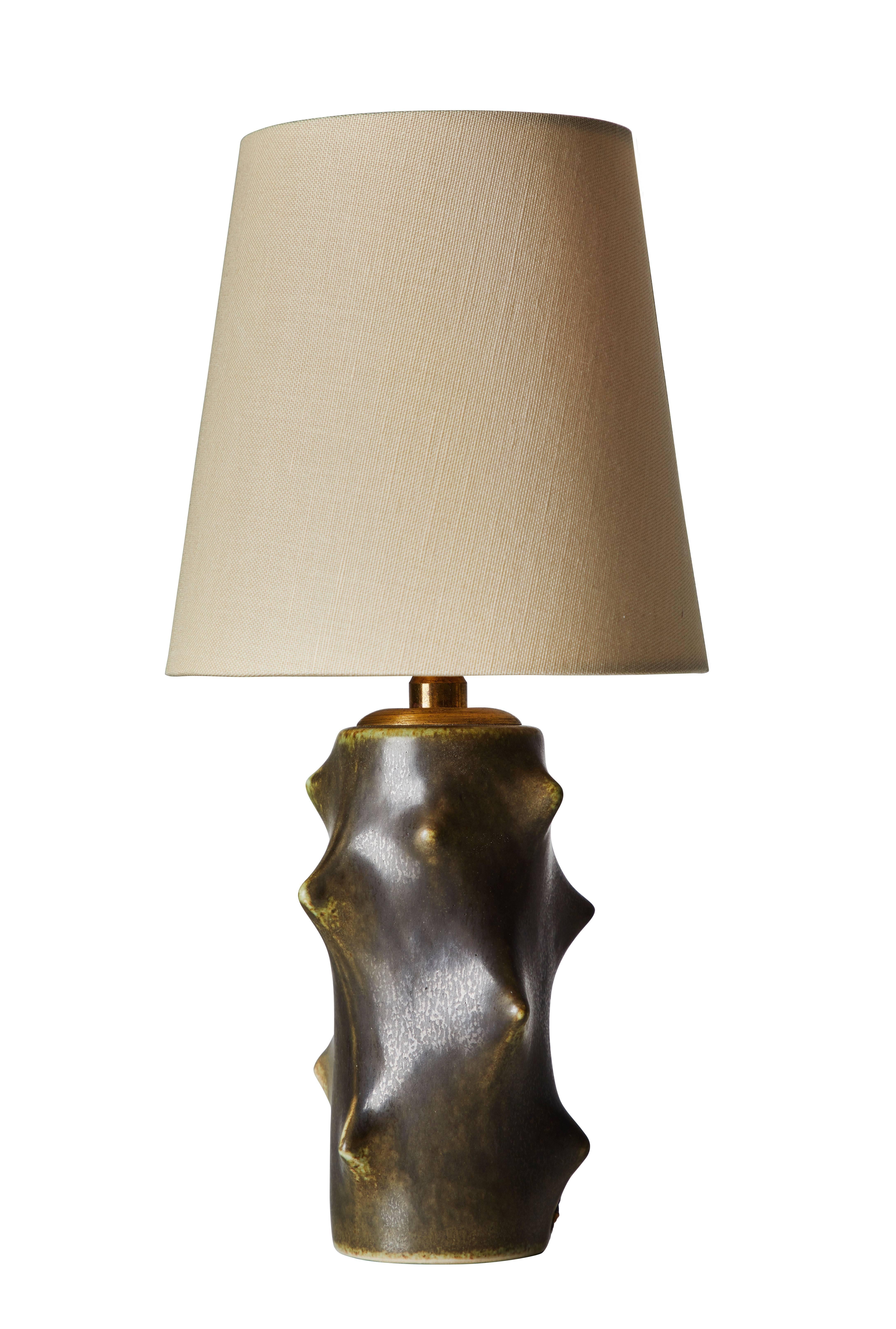 Ceramic table lamp by Michael Andersen and Son for Knud Basse. Designed and manufactured in Denmark circa 1960s. Custom linen shade included. Original cord. Retains original manufacturer’s label. Shade is 7 inches height, 7.25 inches in