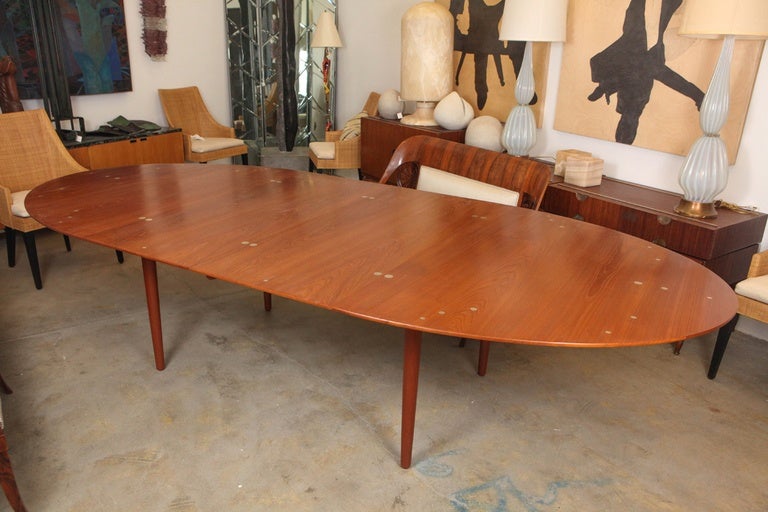 Finn Juhl 'Judas' extendable dining table, circa 1949 teak and brass.