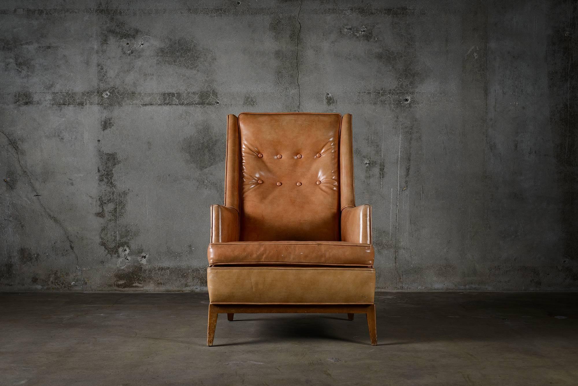 T.H. Robsjohn Gibbings for Widdicomb highback lounge chair in walnut with original leather upholstery, 1950s.