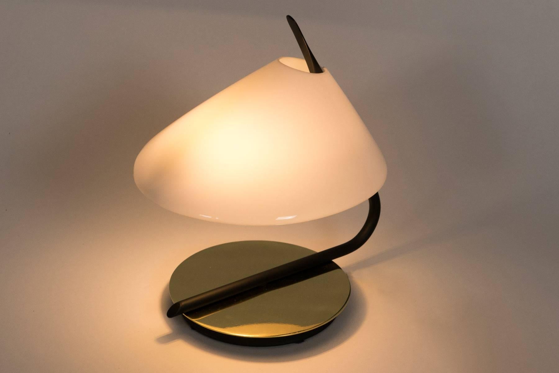 This small-scale lamp enhances shelves, small side tables, or it fits about anywhere. The soft light which is diffused by the acrylic shade is accented by the reflection from the brass base. Lamp uses one candelabra based bulb. Max wattage 25.