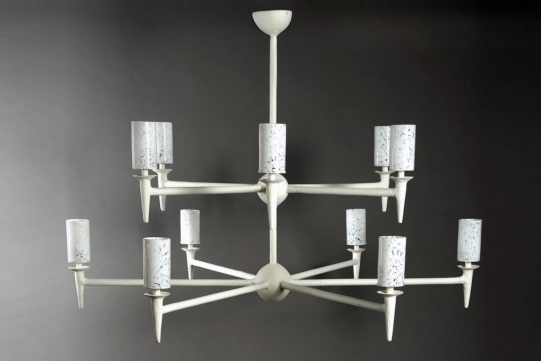 This large chandelier which is part of our Plaster of Paris Lighting collection, can be made custom. This model features 12 arms on two tiers. The light is diffused through the handblown glass cylinders which provide a beautiful glow. Two options