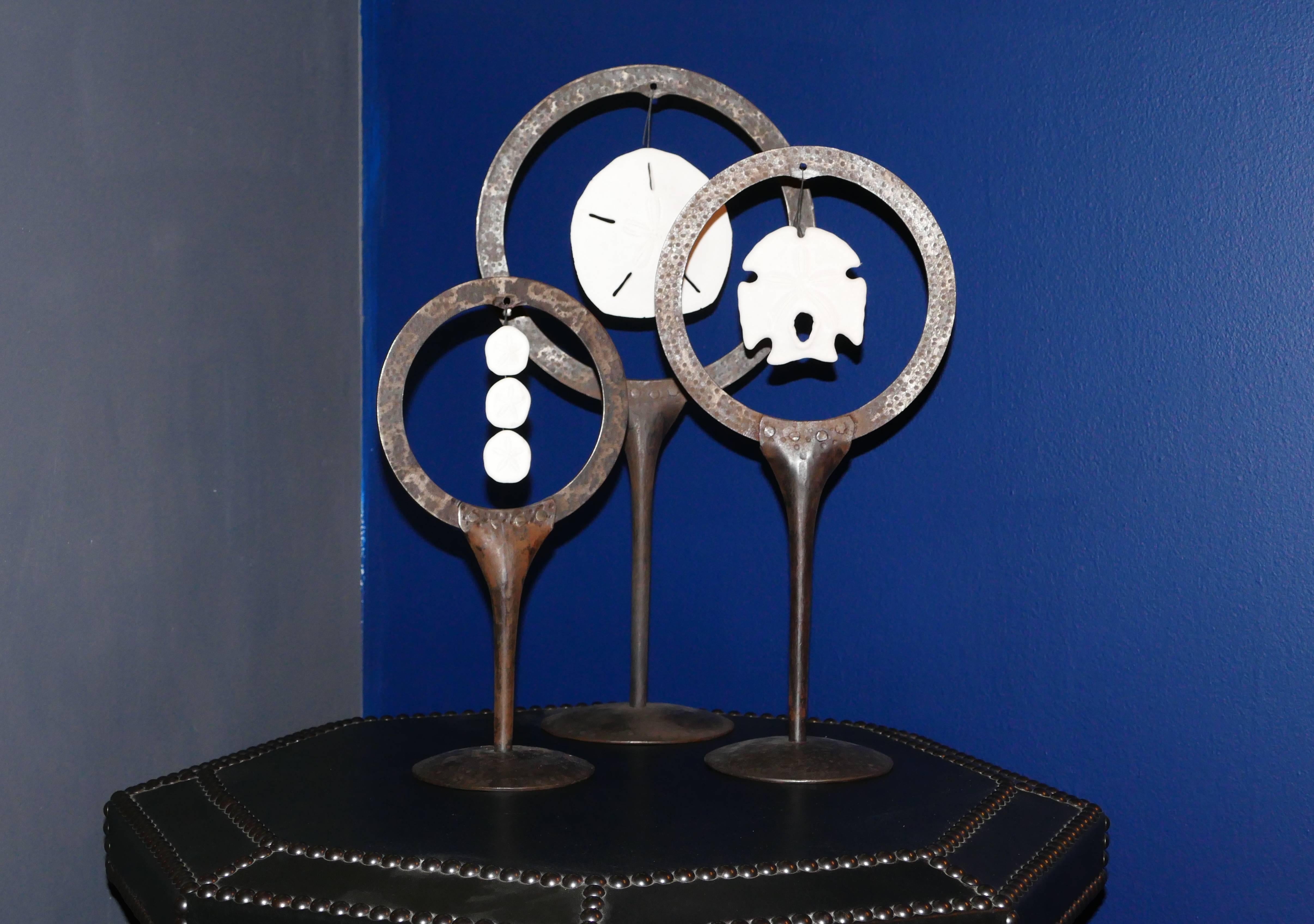 Three varying height decorative objects. Each steel stand holds a sand dollar. Sold as a set, Item is in our stand at the NY Design Center.
 