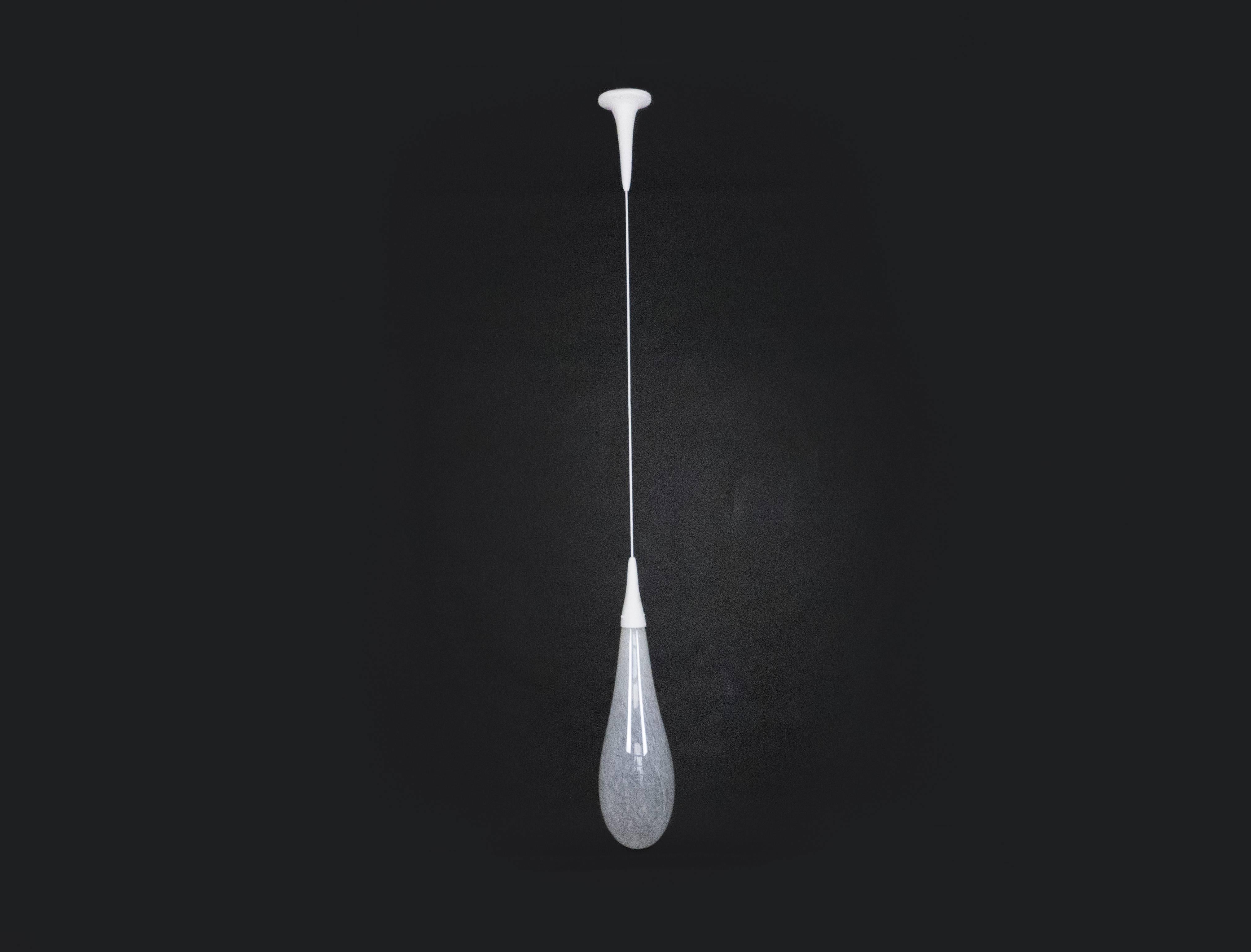 This unique creation from our workshop combines a handblown glass drop and our signature plaster of Paris finish. This creation is one off creation.  