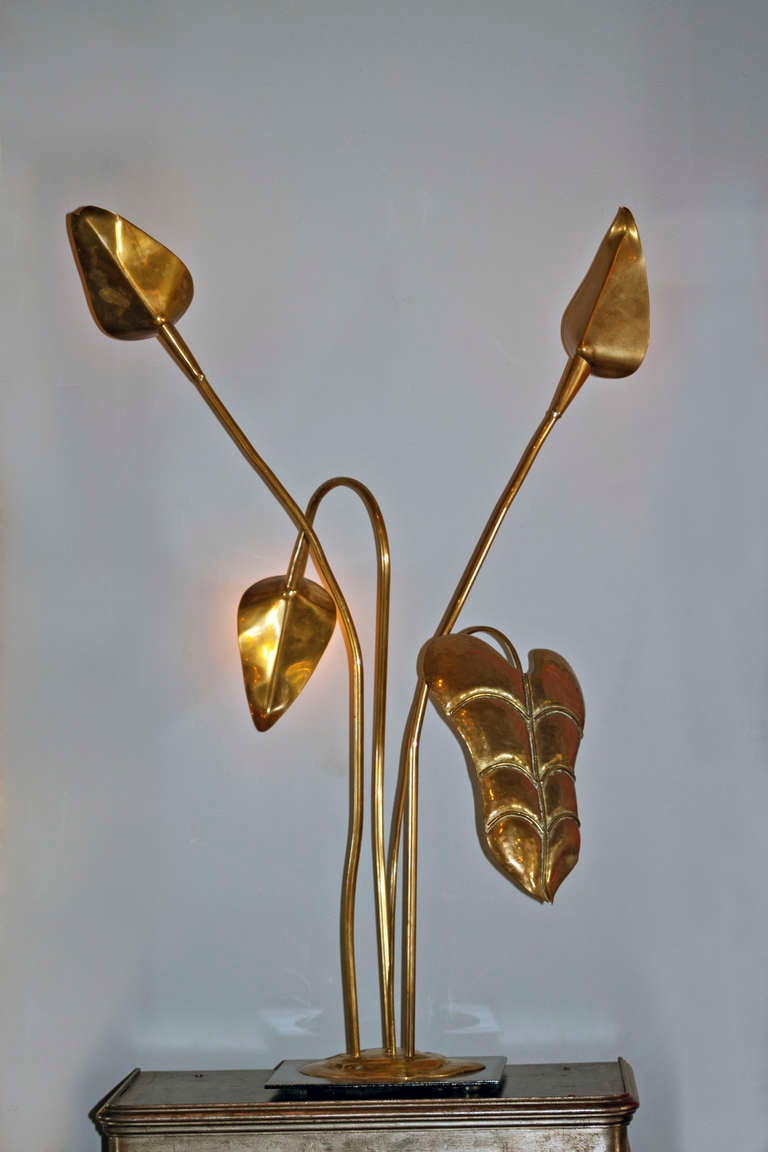 Brass table lamp with philodendron leaf shapes. A Classic lamp from Maison Charles, Paris. This lamp has been rewired for the US. This lamp is in our showroom in NYC in the NY Design Center.