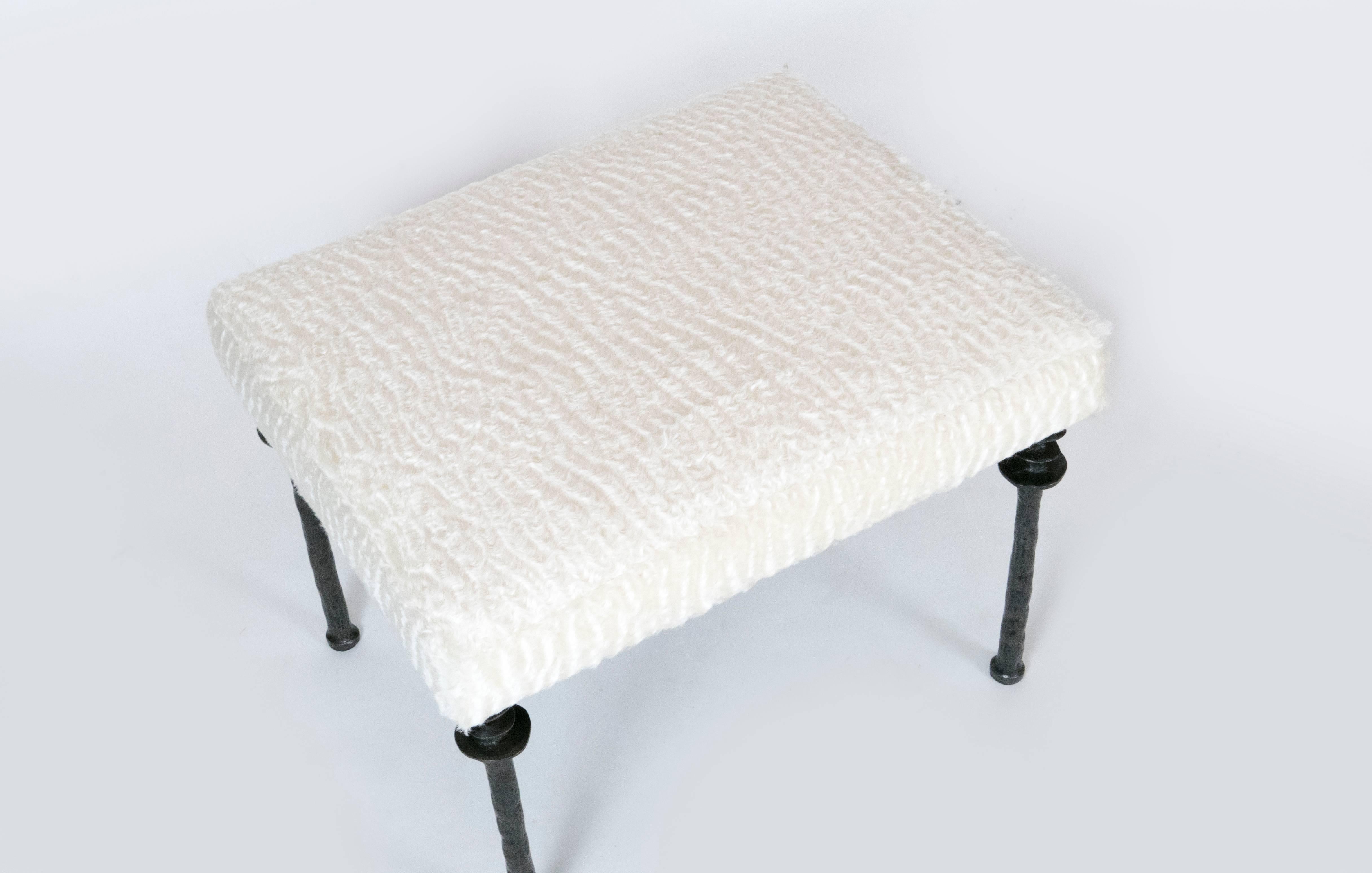 Two beautiful stools inspired by Diego Giacometti, these stools are ideal for
those who are looking for unique seating. Their cast bronze legs provide
a truely organic touch. The seat cushion has been upholstered in an off white faux fur. These