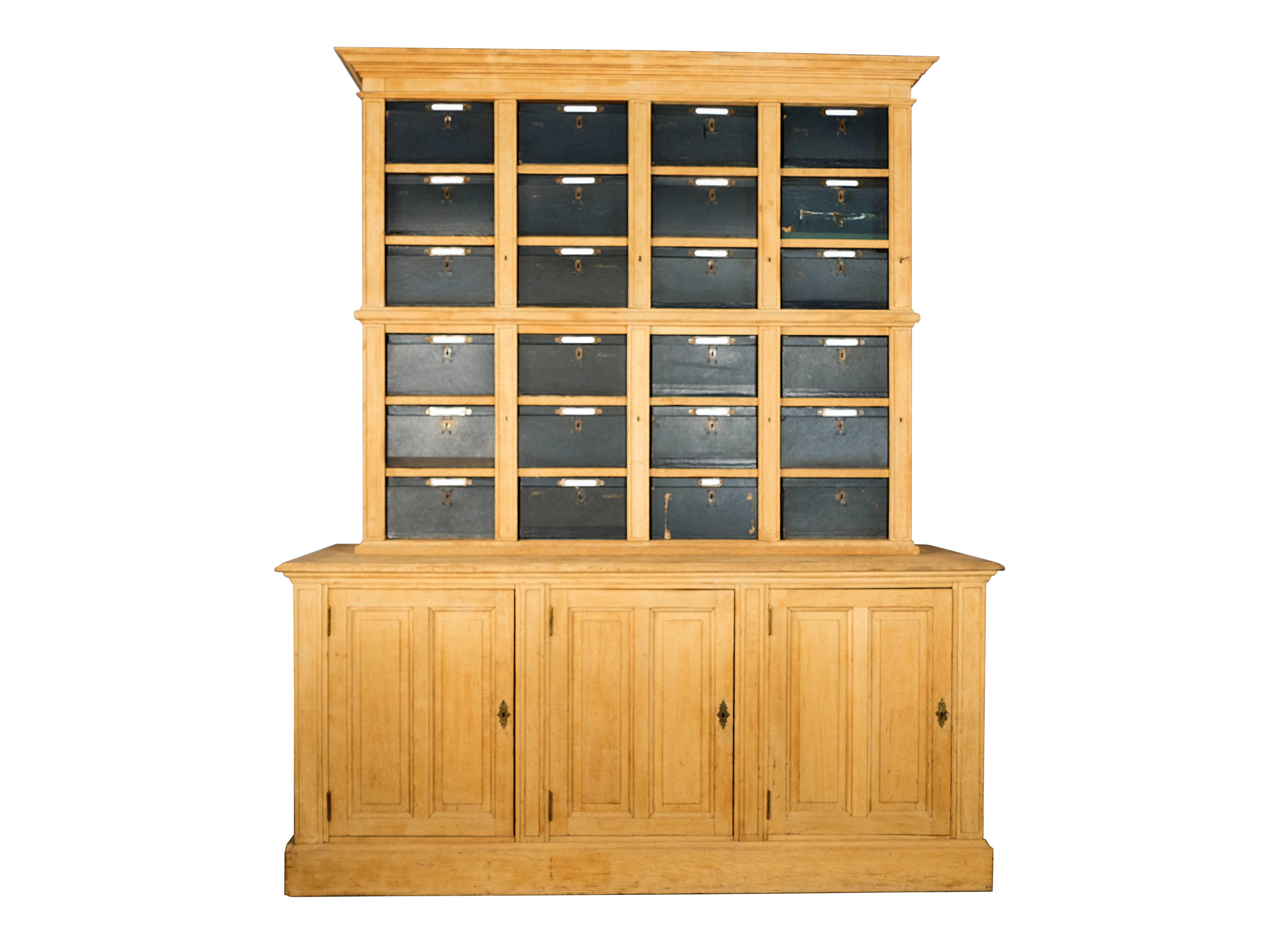 This beautiful and rare piece came from a Parisian lawyer office to hold the confidential files.
French oak cabinet with 24 removable cardboard drawers/boxes with brass latches (box size: W 14