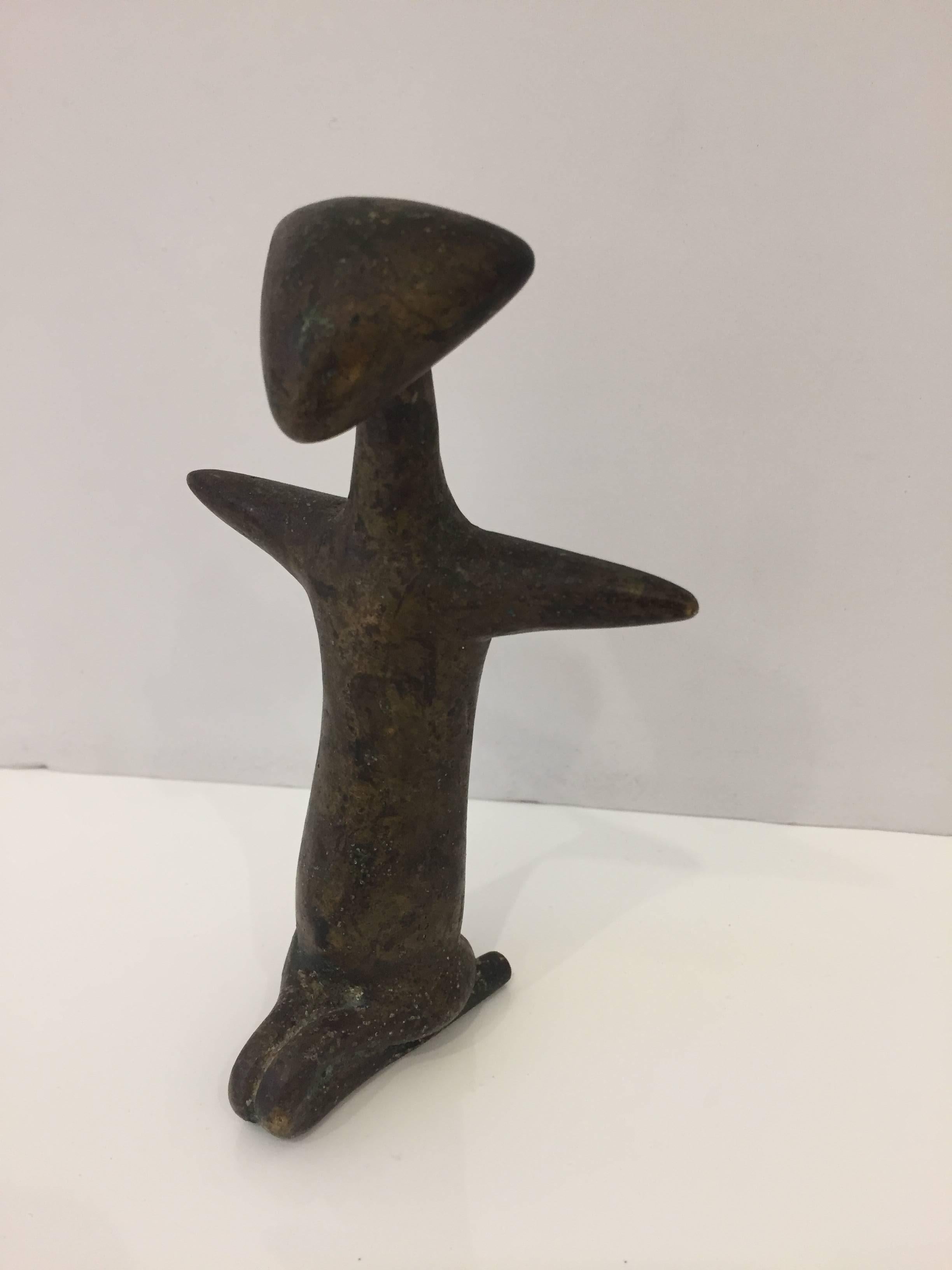 This hand cast bronze figure of the human form is from the Ivory Coast in Africa. This item is in our NYC showroom in the 1stdibs Gallery @ 200 Lex.