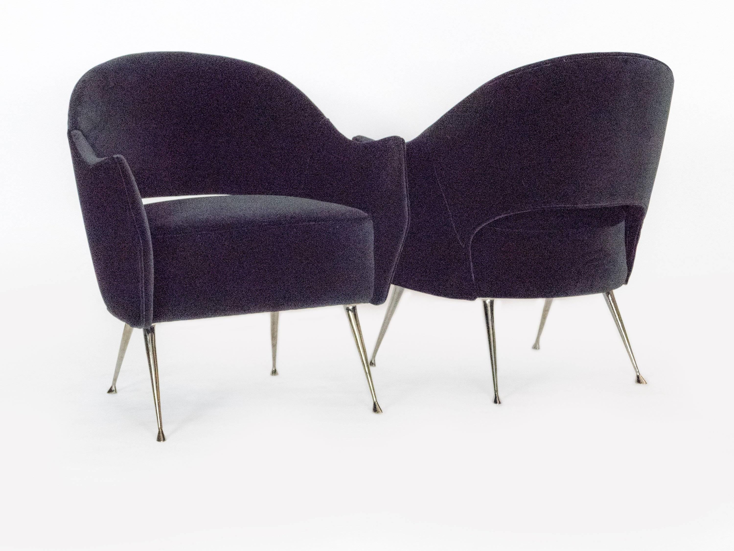 These elegant chairs have black nickel-plated legs and a distinctive curved back. The chair is very comfortable, perfect in size and are ideal as small scale side chairs. The beauty of the tapered legs with their graceful feet are sure to add that