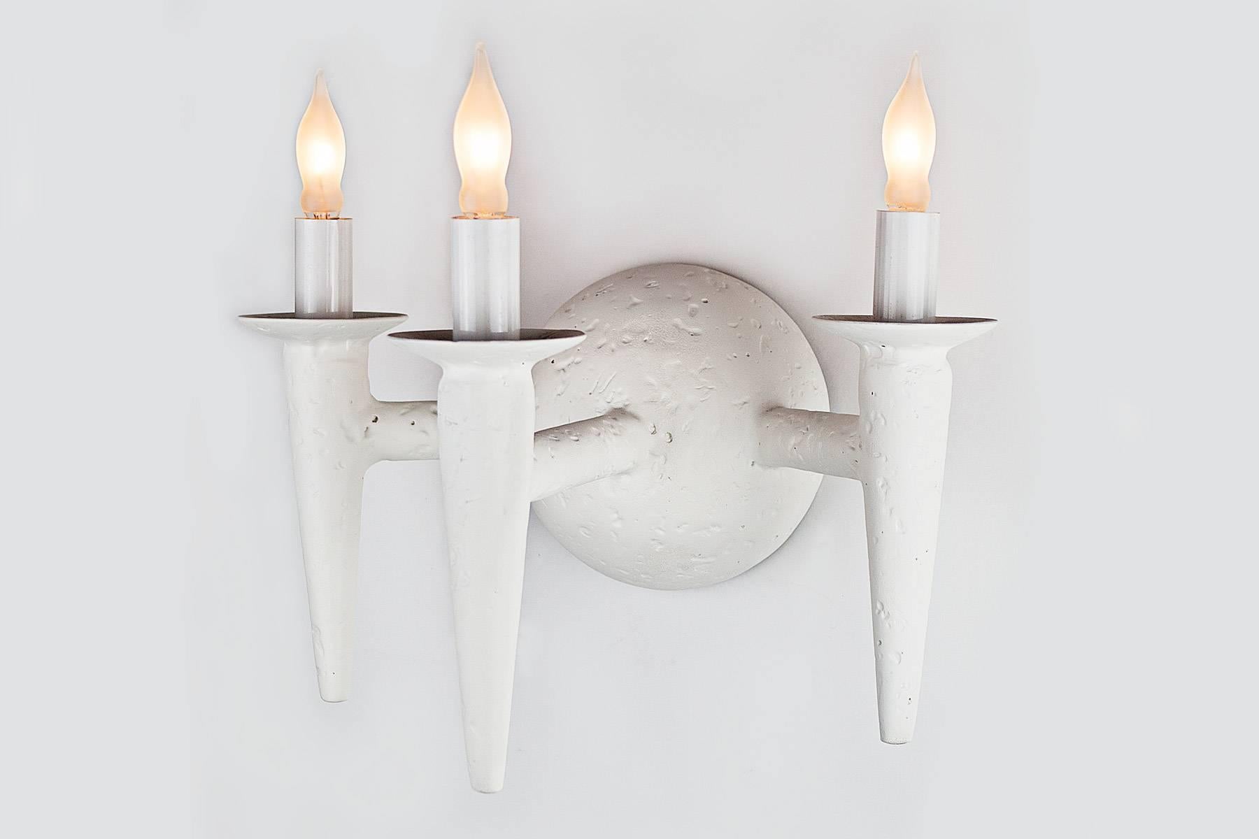 Two wall sconce with plaster finish. Fixture uses three candelabra based bulbs, Max wattage 60 each. Lights fits on a standard J box.