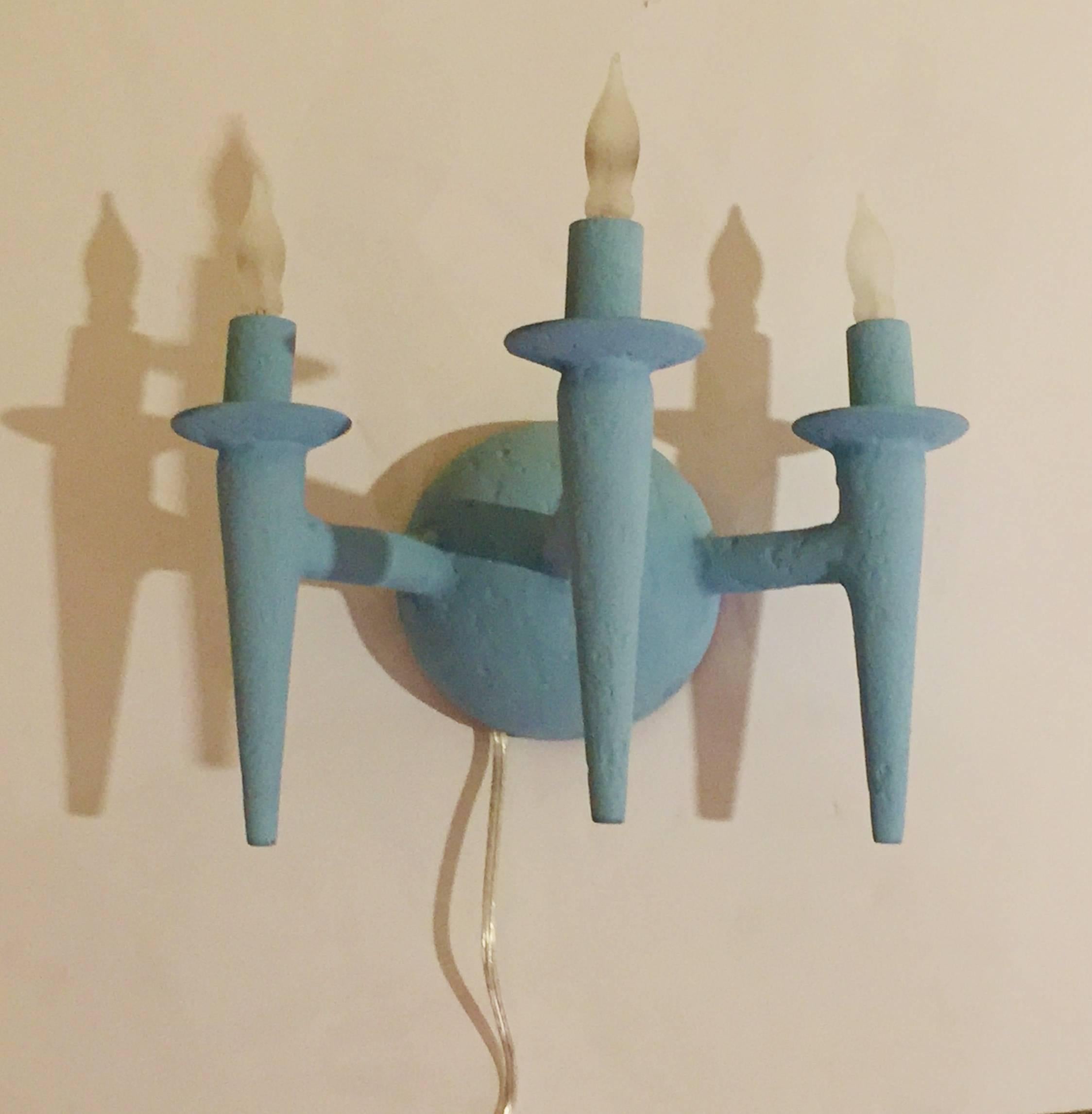 Two wall sconce with plaster finish. Fixture uses three candelabra based bulbs, Max wattage 60 each. Lights fits on a standard J box. The sconces have been painted with Benjamin Moore Marlborough blue paint. Custom sconces can have custom paint