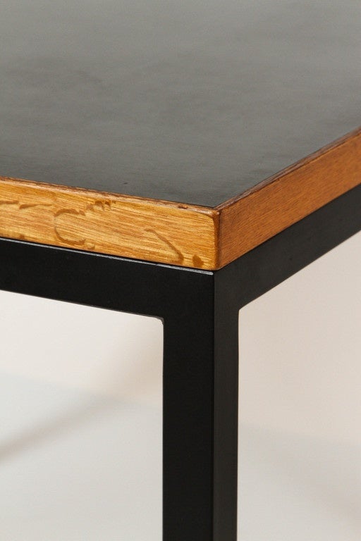 Oak framed laminate top on steel legs.
Created by Finnish furniture house Asko Oy.
Designed by Tapio Wirkkala in 1960.