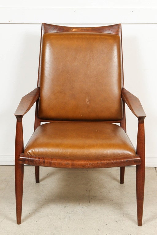 California craftsman John Nyquist designed this pair of high back chairs.

Walnut with leather upholstery.