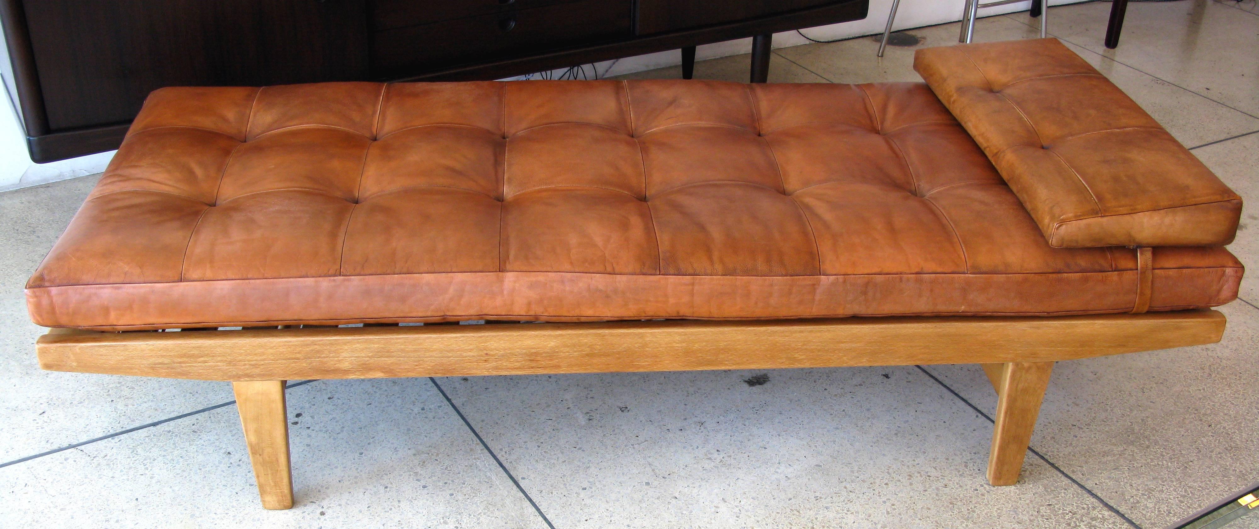 Leather and teak daybed by Poul Volther.  Beautifully aged tufted cognac leather cushion with matching leather wedge pillow.

* ON SALE - 25% OFF.  Originally $7200.  LIMITED TIME ONLY.  No further discounts.