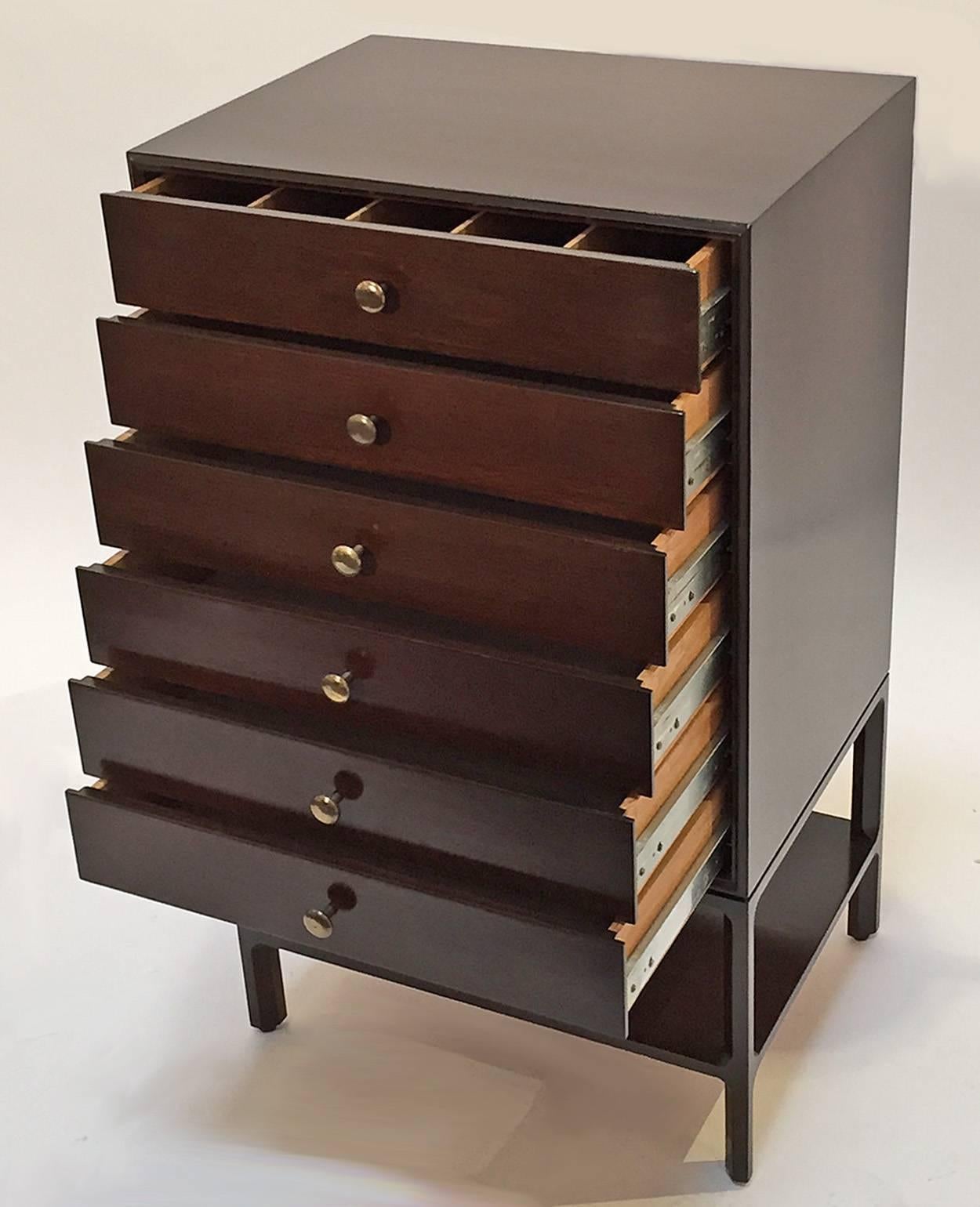 Small six-drawer dresser designed by Edward Wormley for Dunbar Furniture.
Features dark walnut with brass pulls. Retains the original Dunbar tag.
Top quality design and craftsmanship.