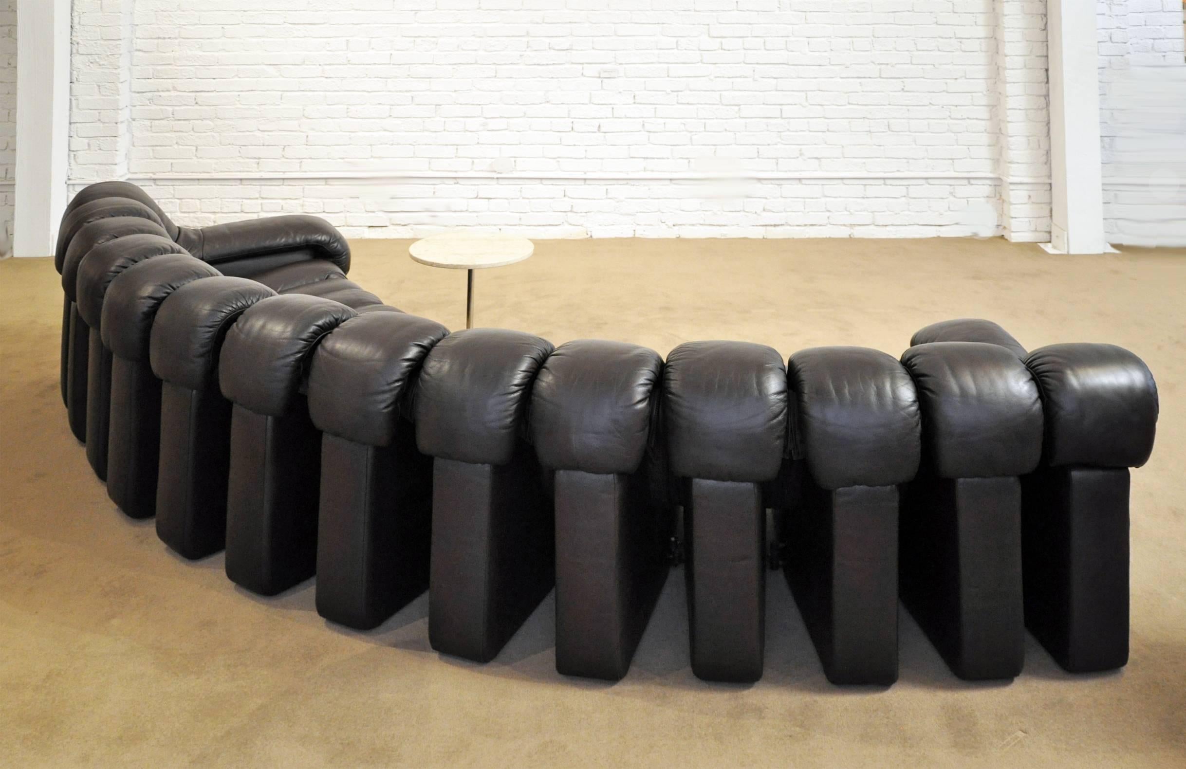 Designers: U. Bergere, E. Peduzzi Riva, H. Ulrich, K. Vogt designed this sofa for De Sede, Switzerland. Created in 1972, this sofa features 14 pieces that zip together. Completely covered in leather including the end pieces which have arms. This is