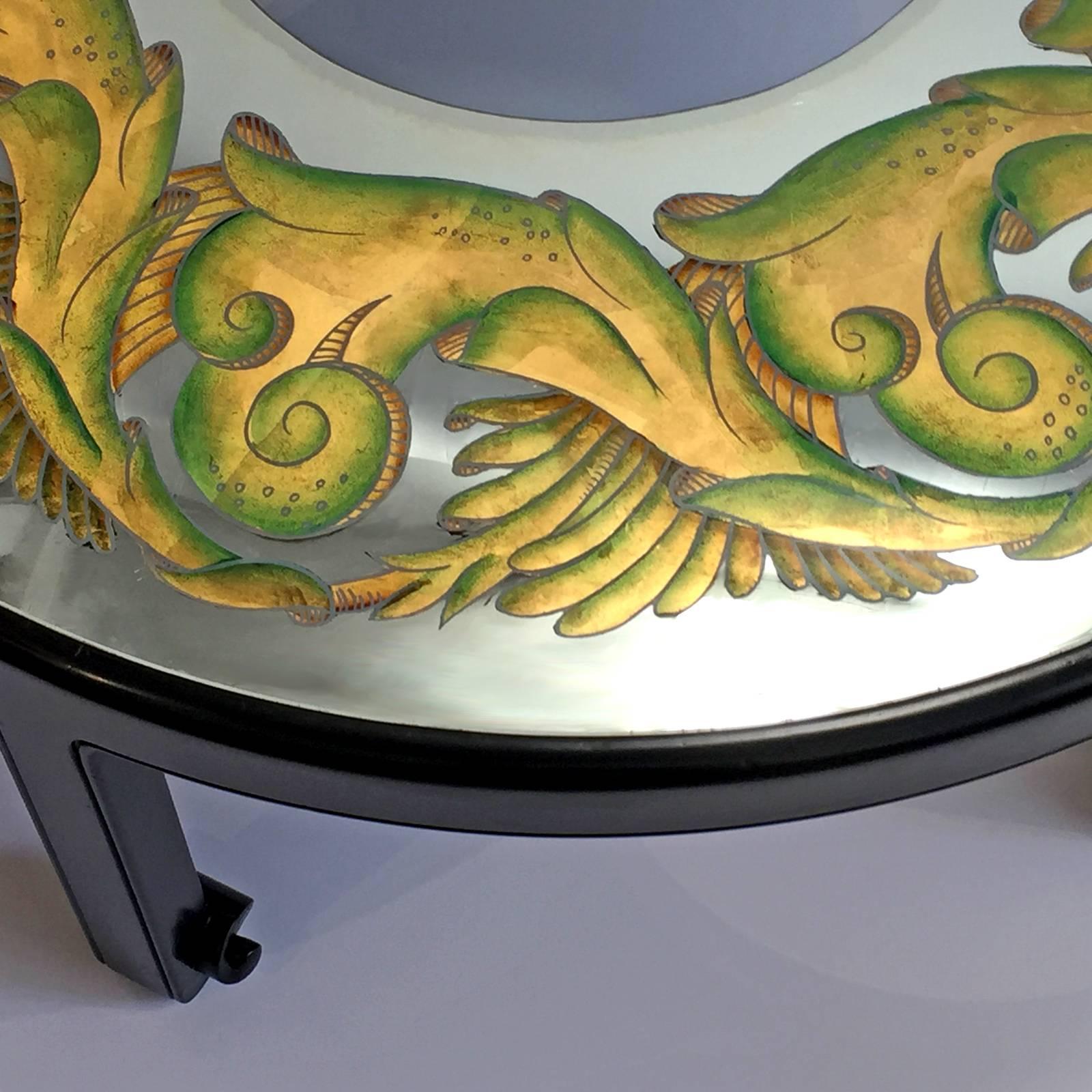 Exquisite original custom table. Reverse painted mirror top (Églomisé) coffee table on five carved walnut legs. The wood is finished. All original condition. Ready for use.

Complementary delivery in the Los Angeles / Beverly Hills area and Pasadena